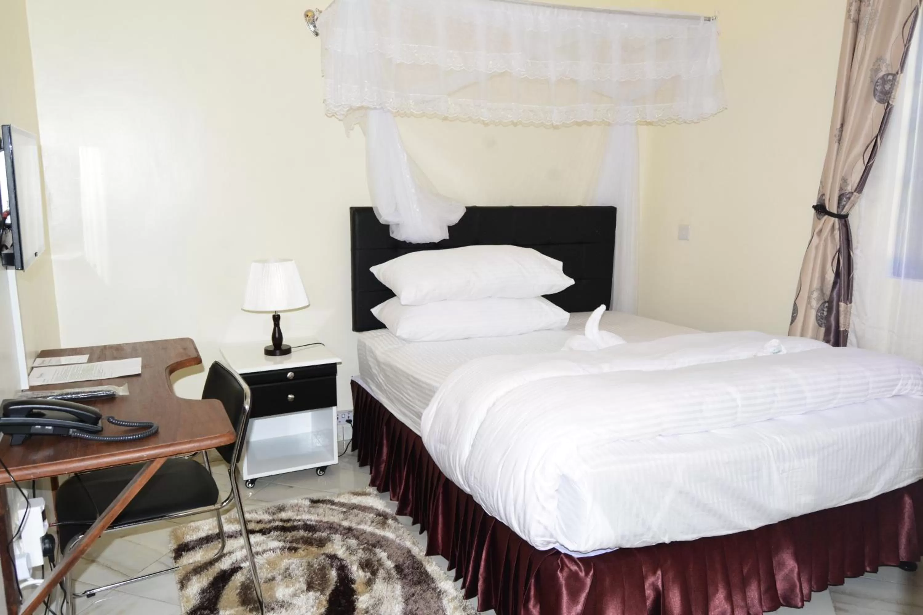 Bed in Africa Lodge Arusha