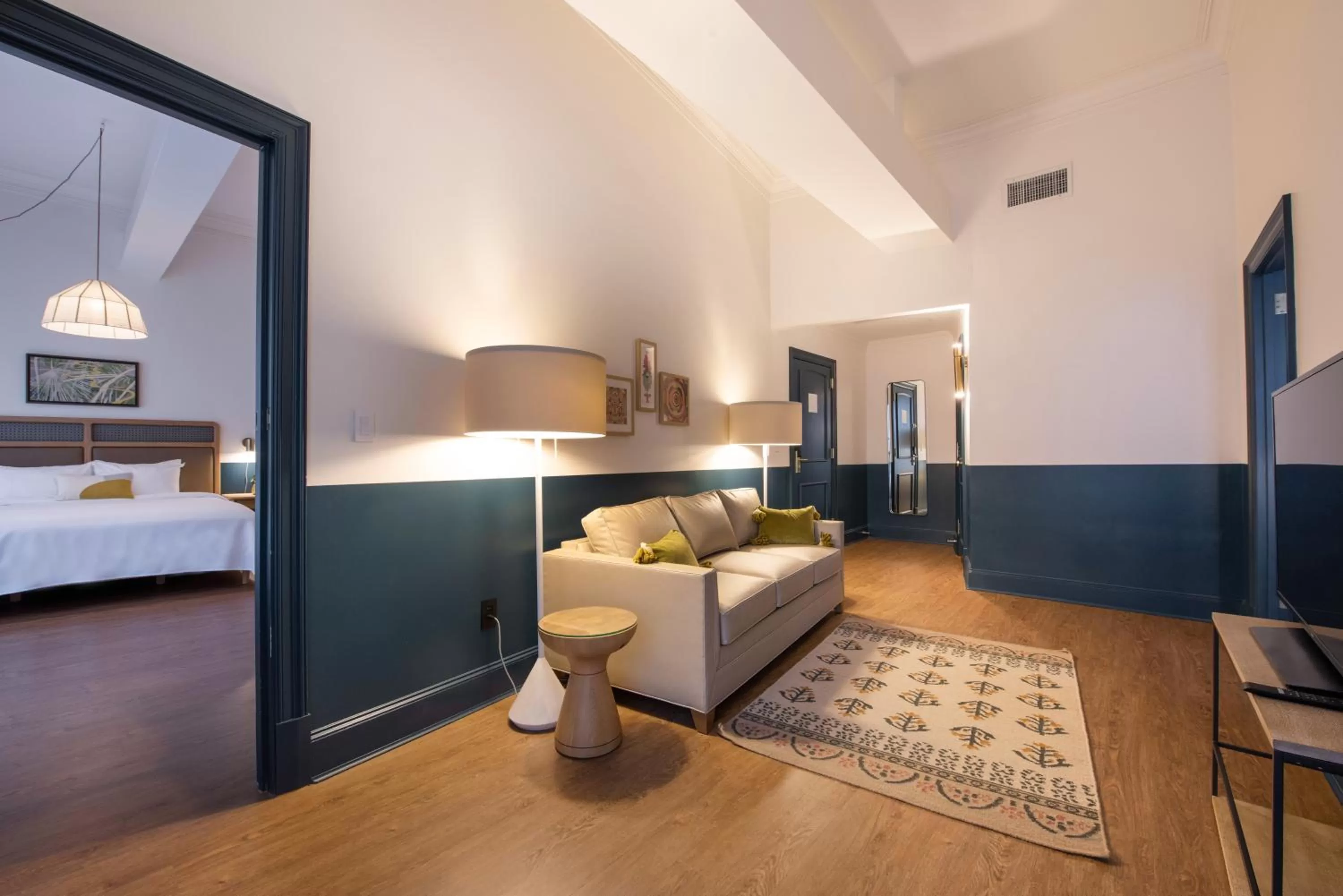 Living room, Bed in Hotel Theo New Orleans, Tapestry Collection by Hilton