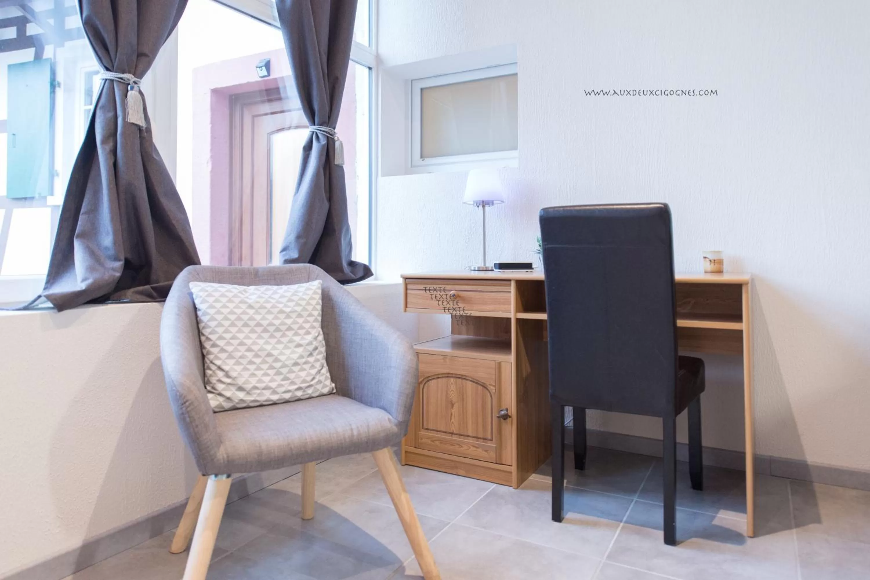 Seating area in Maison d'hôtes Aux Deux Cigognes