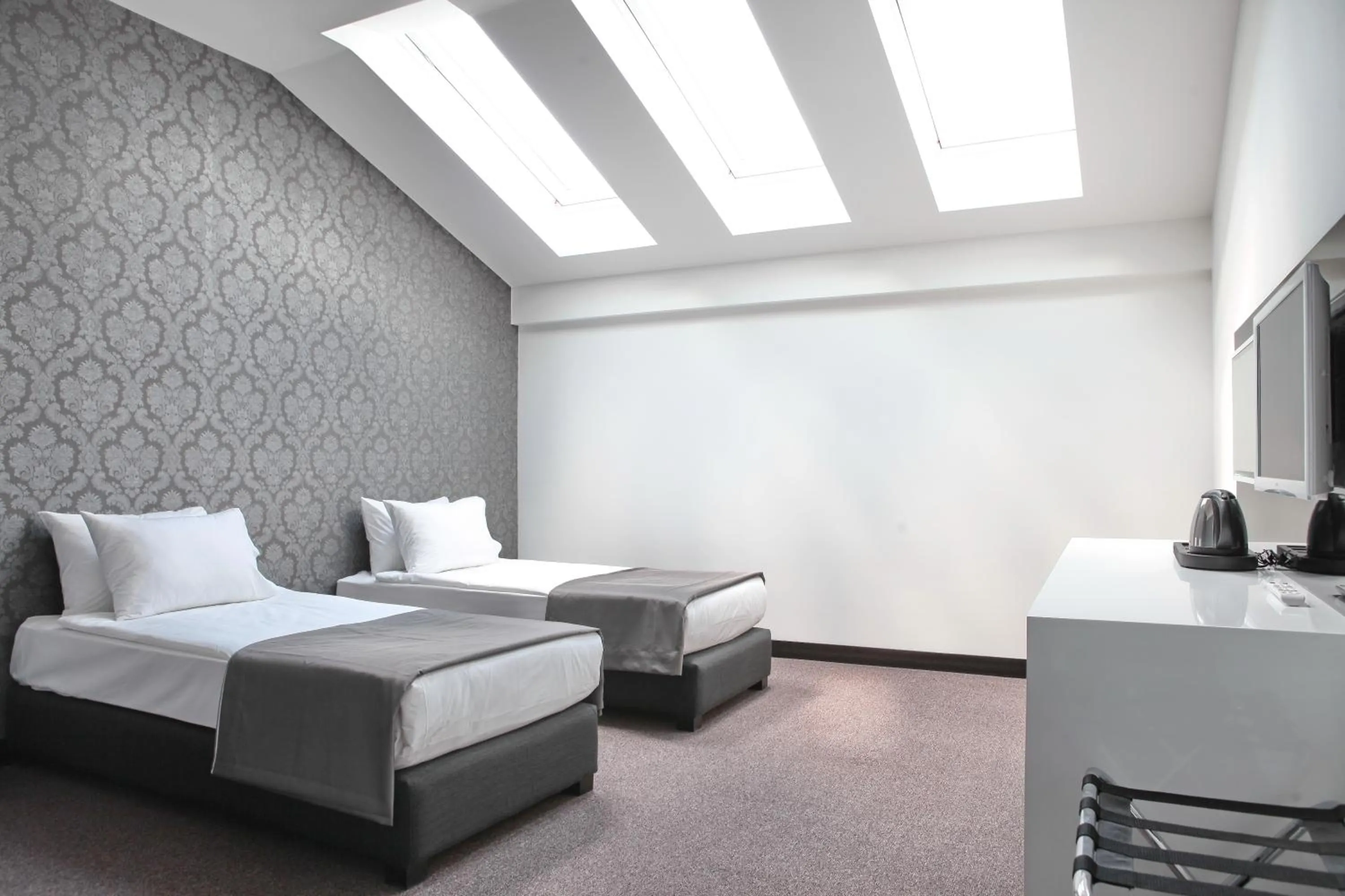 Coffee/tea facilities, Bed in Nova City Garni Hotel Signature Collection