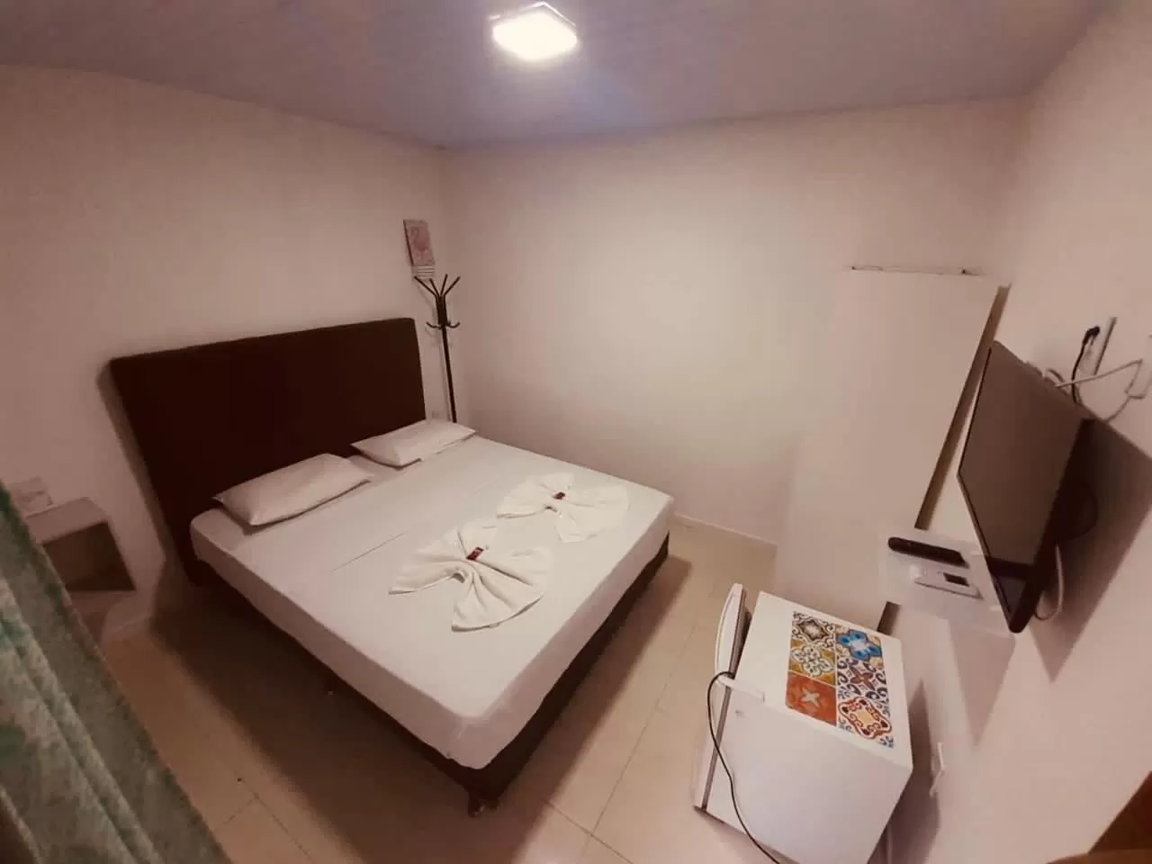 Bed in Flamingo Beach Pousada