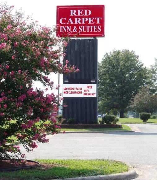 Property logo or sign in Red Carpet Inn Kinston