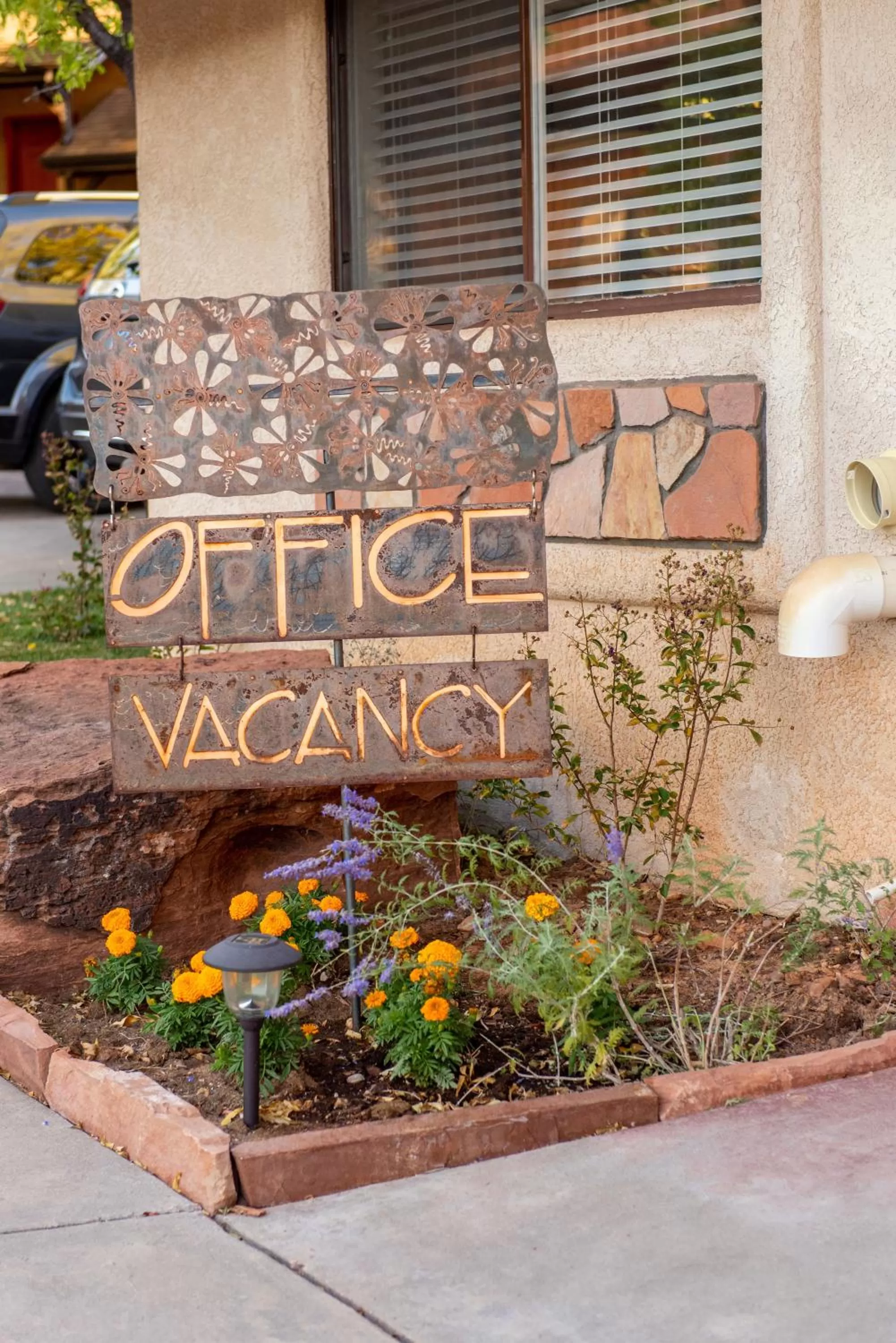 Property logo or sign in Red Rock Inn Cottages