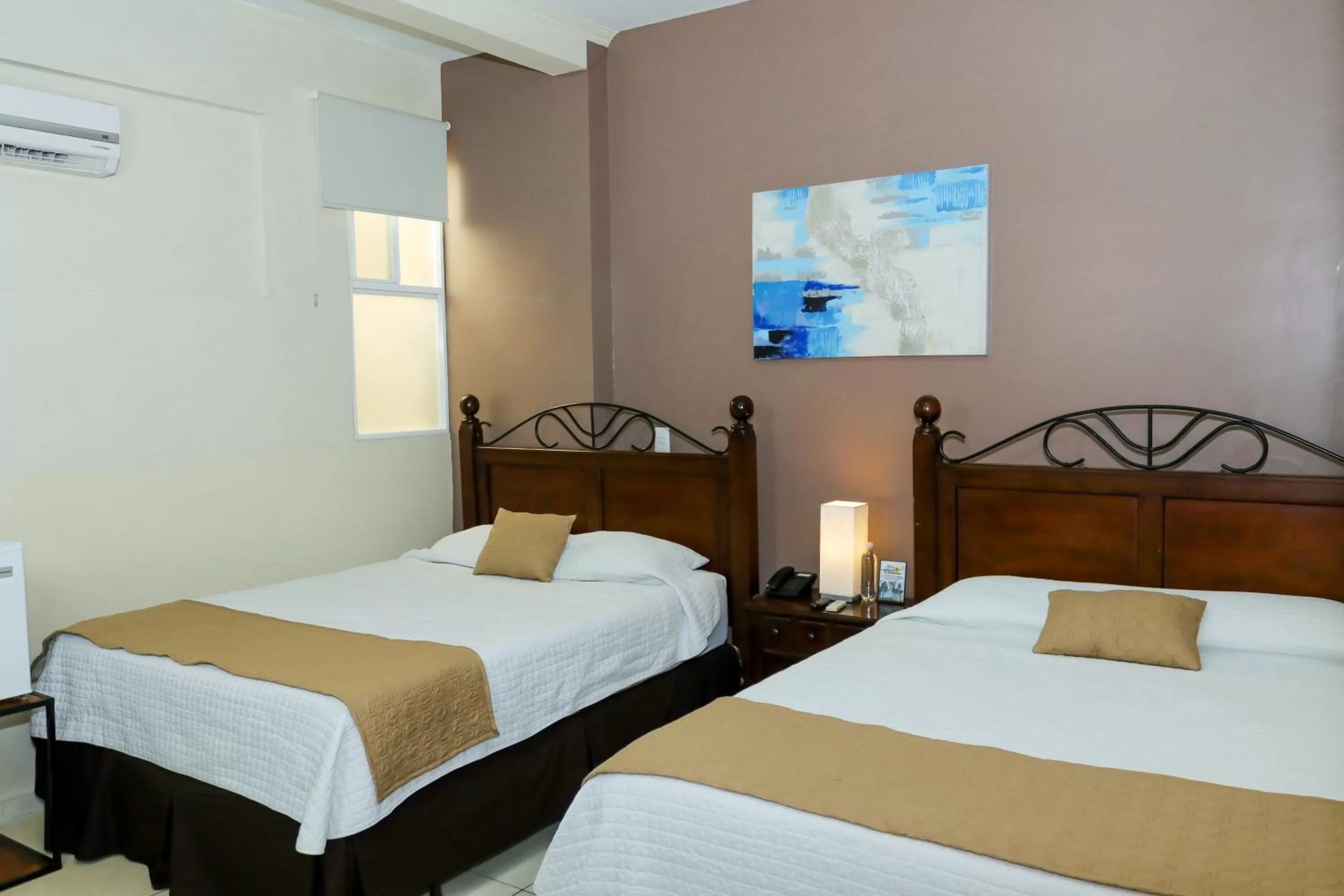 Bed in Las Magnolias Hotel Boutique