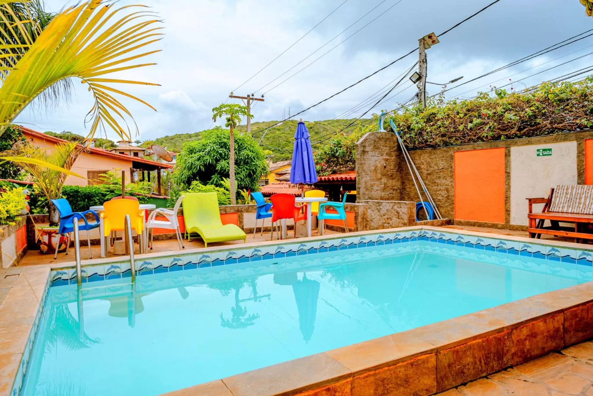 Swimming pool in Suítes Casa do Barão