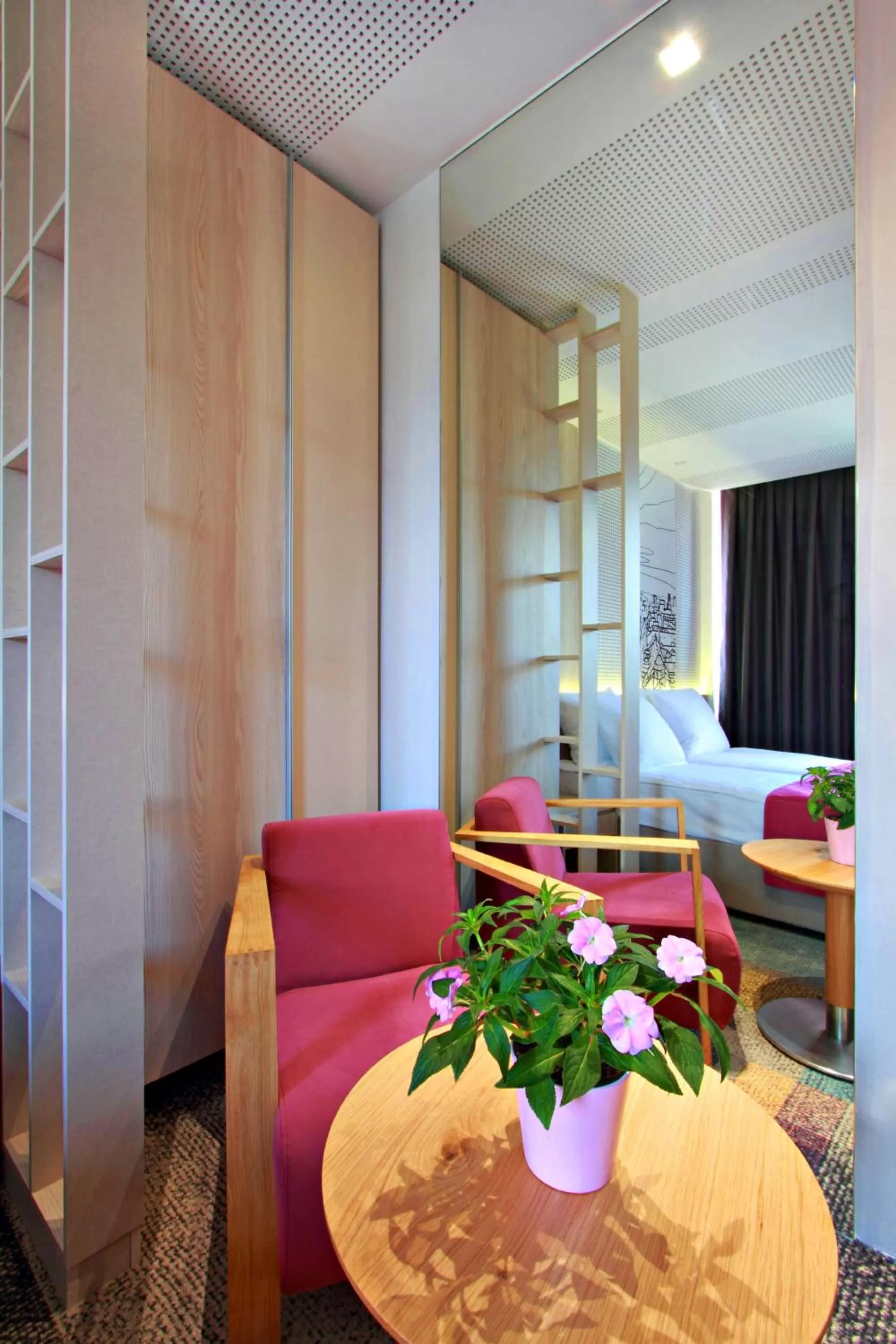 Seating area, Bed in Hotel Cosmopolit