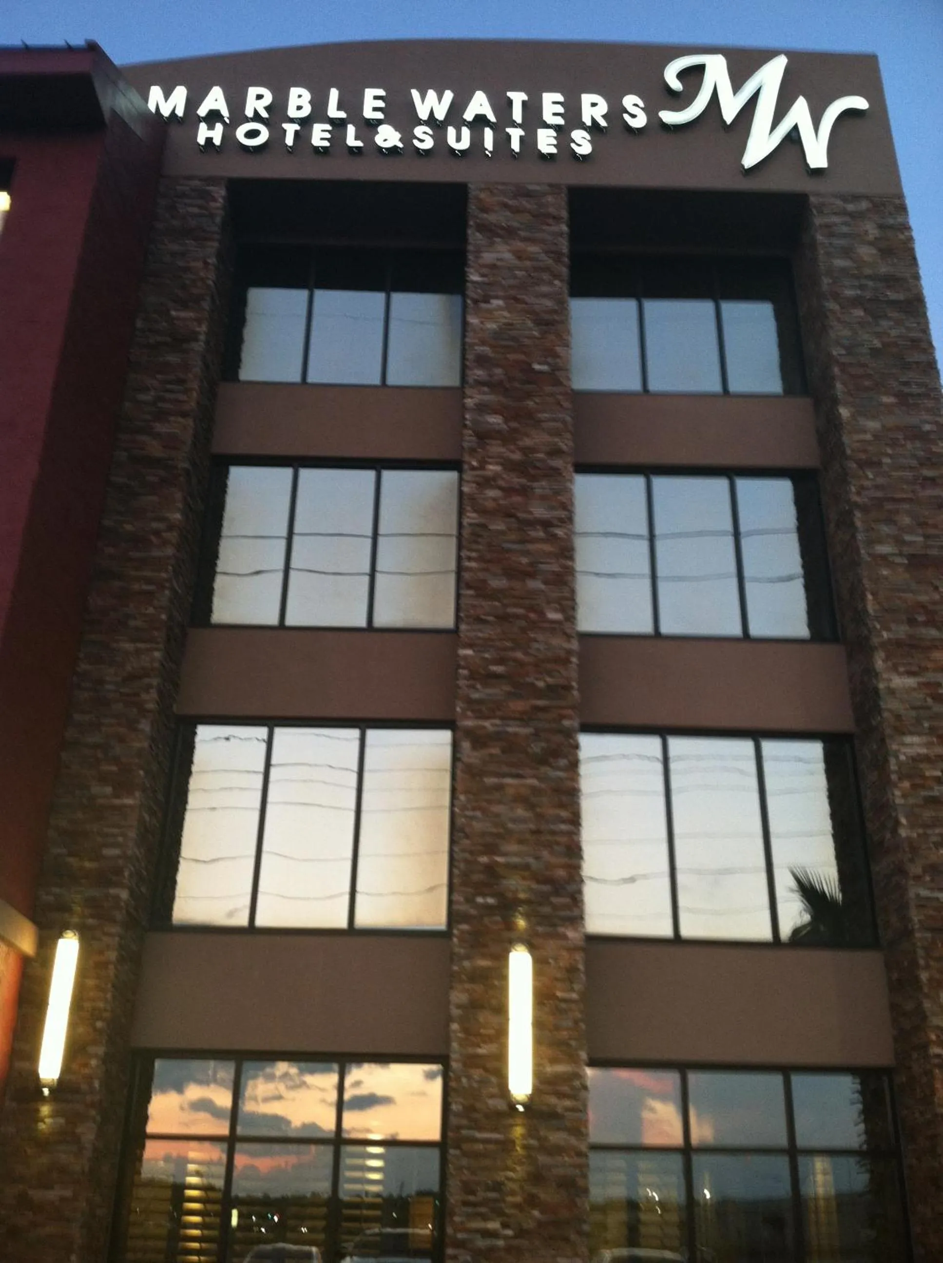 Property building in Marble Waters Hotel & Suites, Trademark by Wyndham