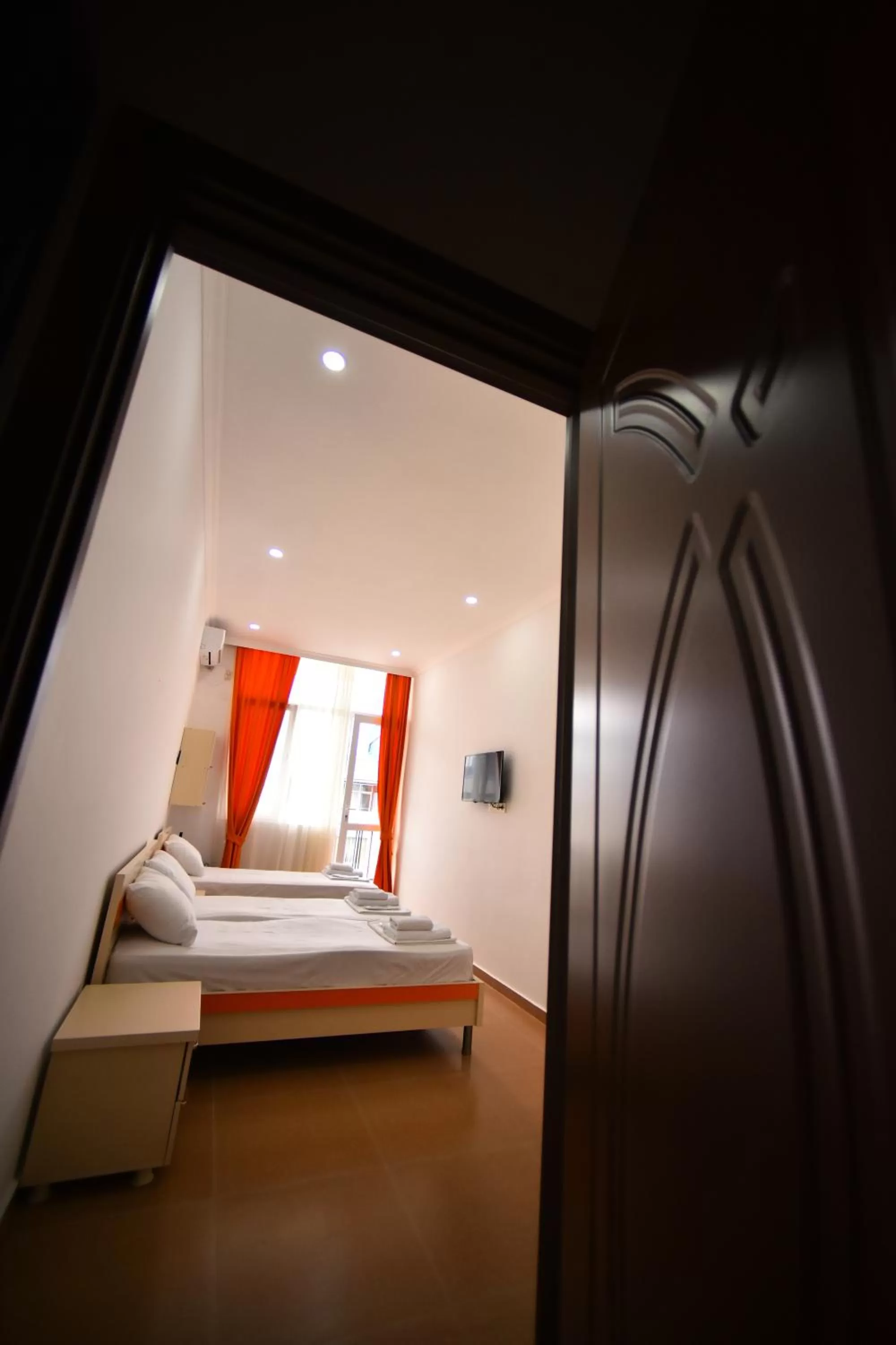 Bed in Orange Home Hotel