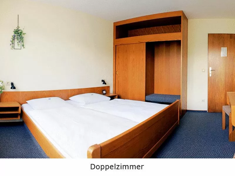 Bed in Hotel Keinath Stuttgart
