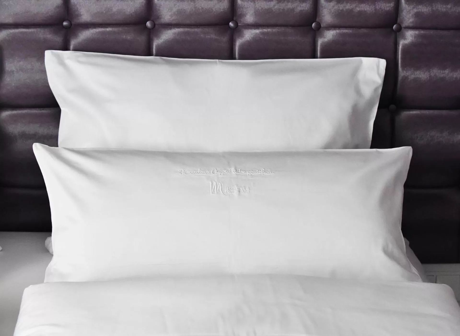 Decorative detail, Bed in MOMENTS Boutique Hotel