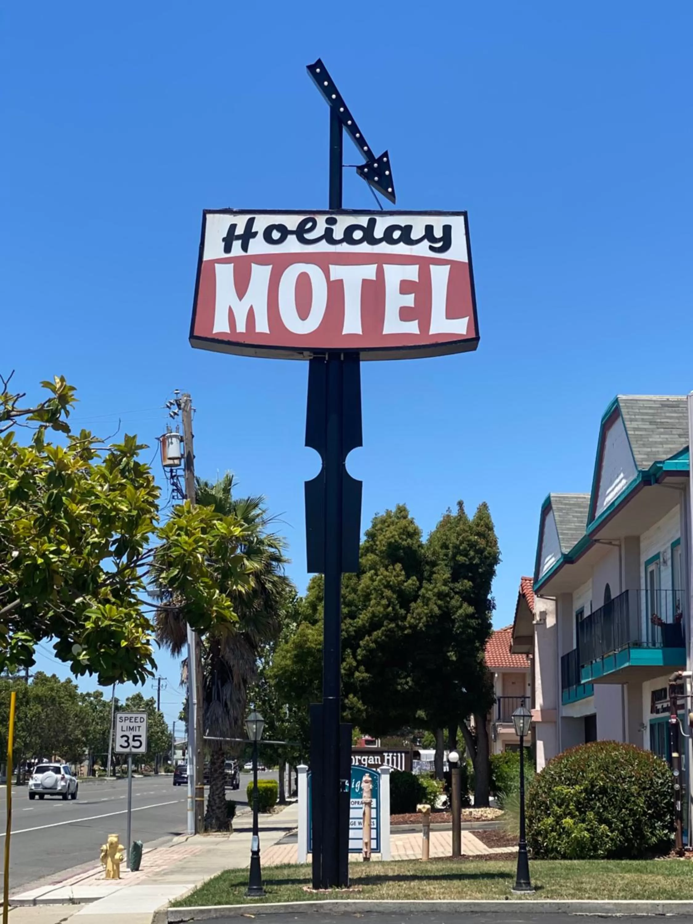 Property logo or sign in Holiday Motel