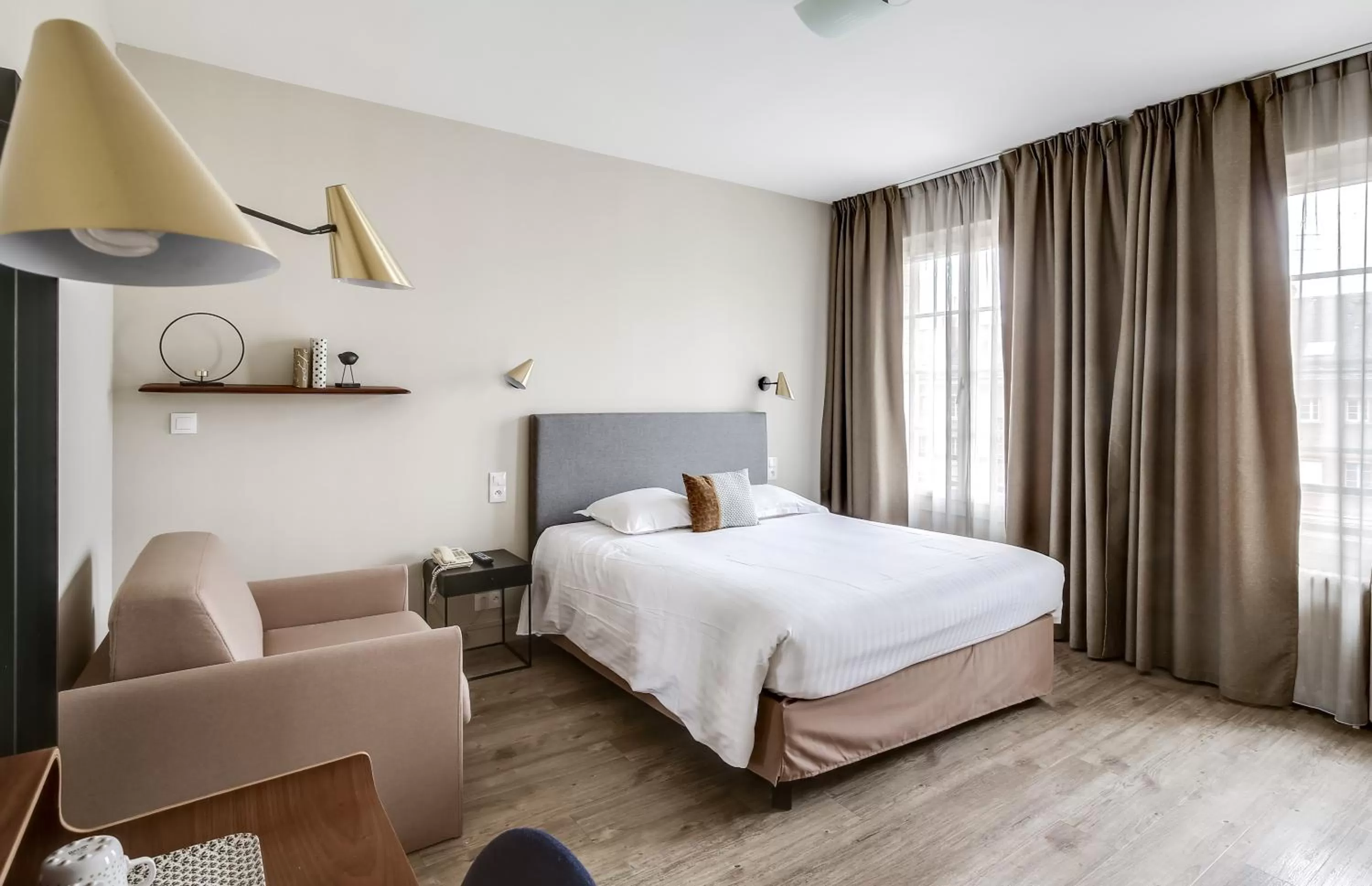 Bed in Logis Hôtel Marguerite