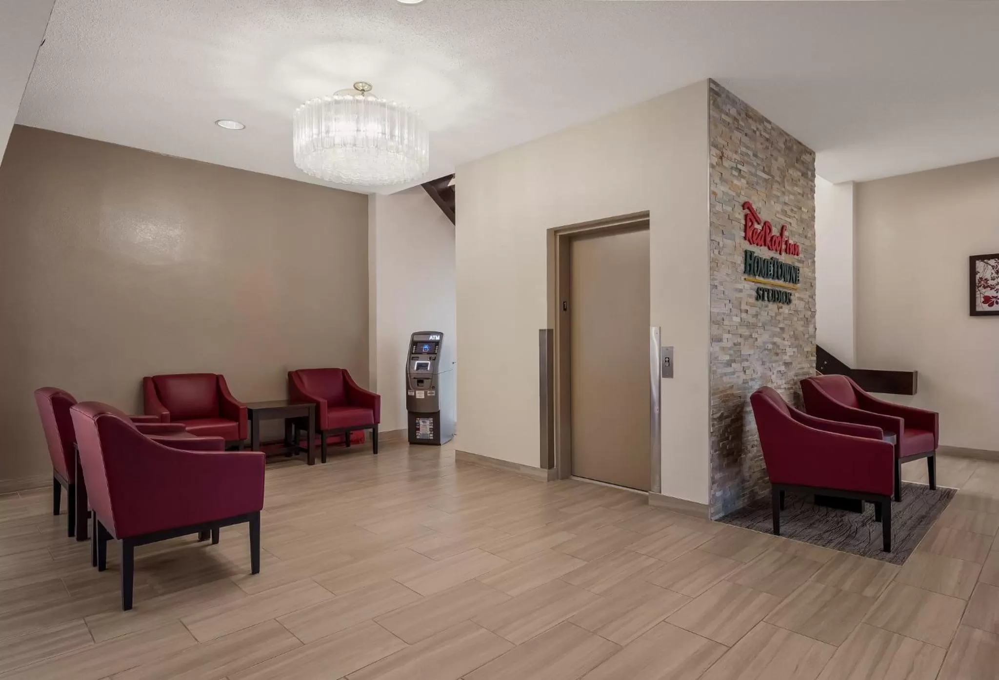 Lobby or reception in HomeTowne Studios by Red Roof Painted Post