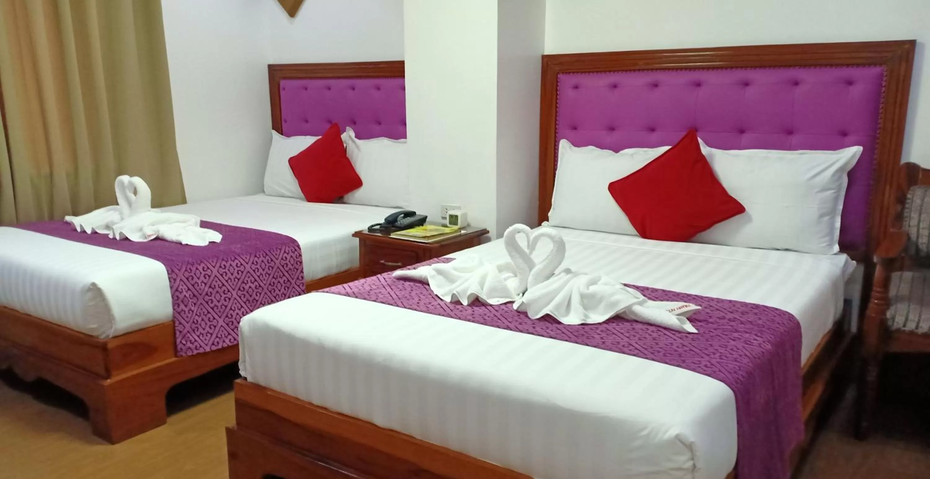 Bed in CLN Boutique Hotel