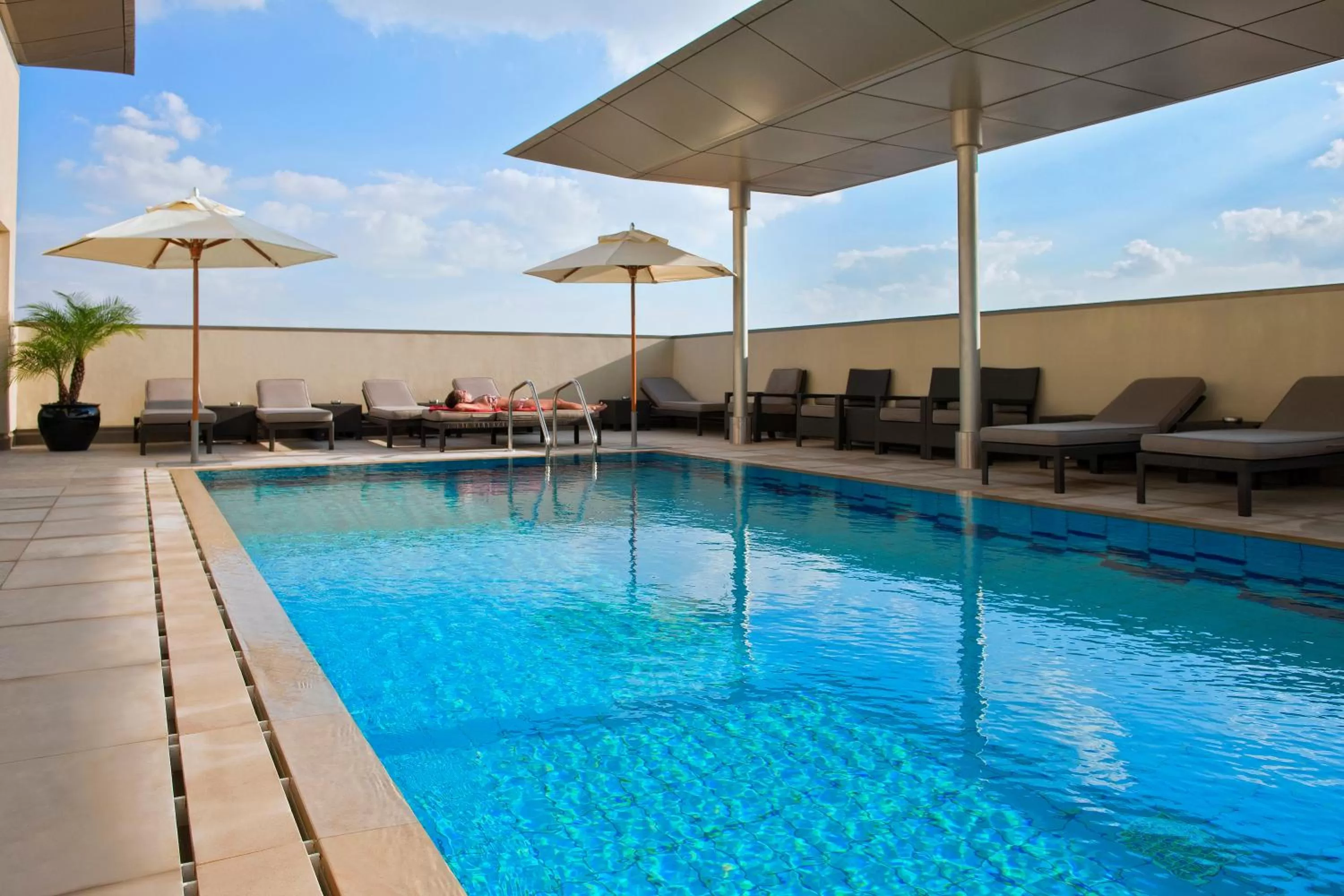 Swimming pool in Centro Al Manhal by Rotana