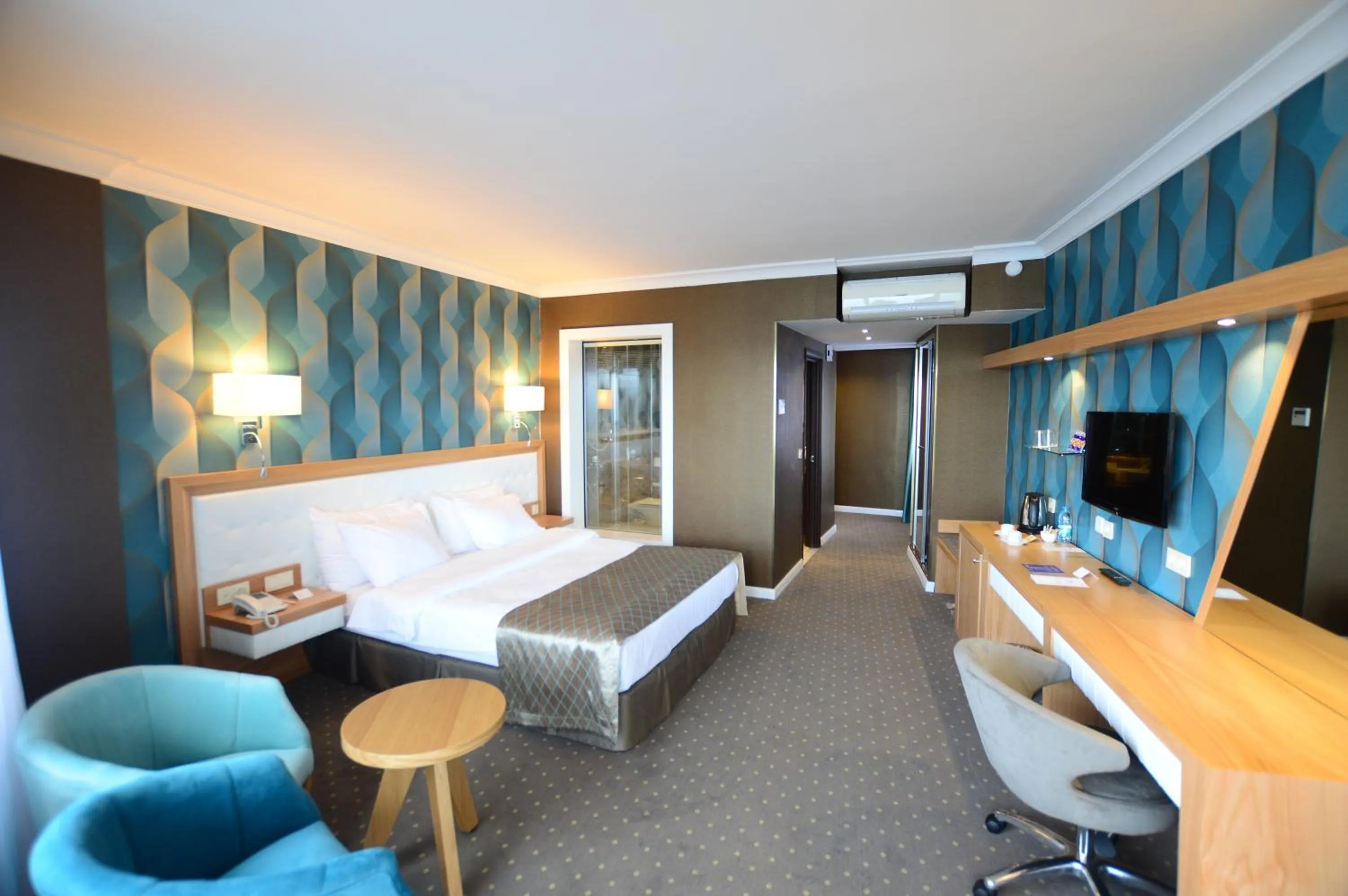 Photo of the whole room, Bed in Akol Hotel