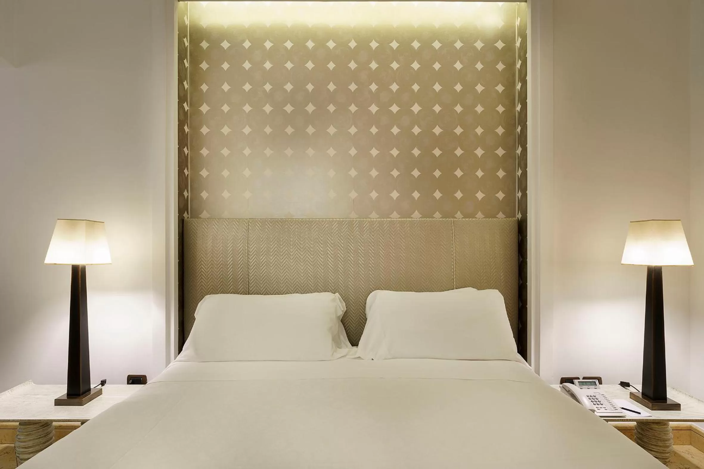 Bed in Romano Palace Luxury Hotel