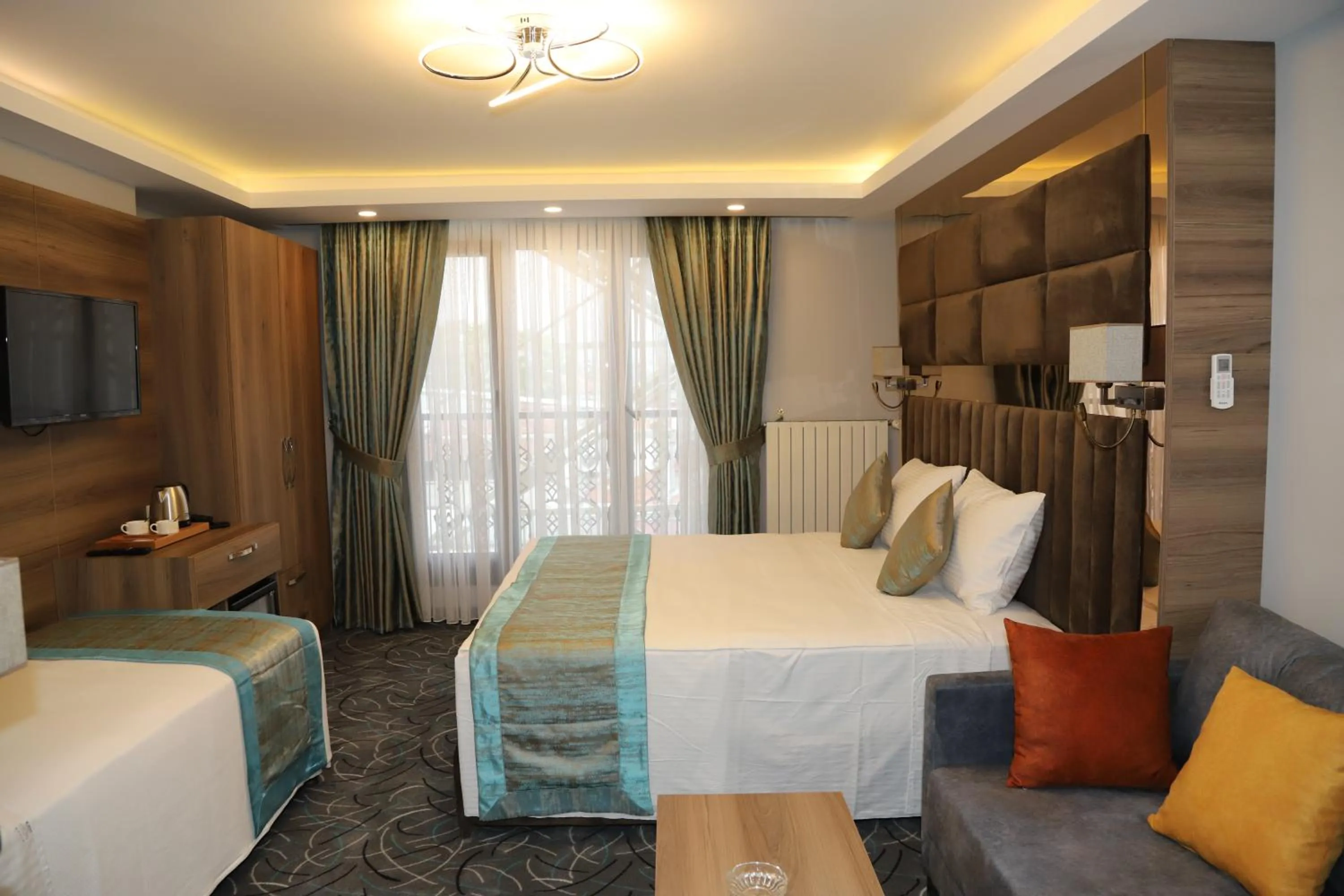 Bed in Grand Kavi Hotel