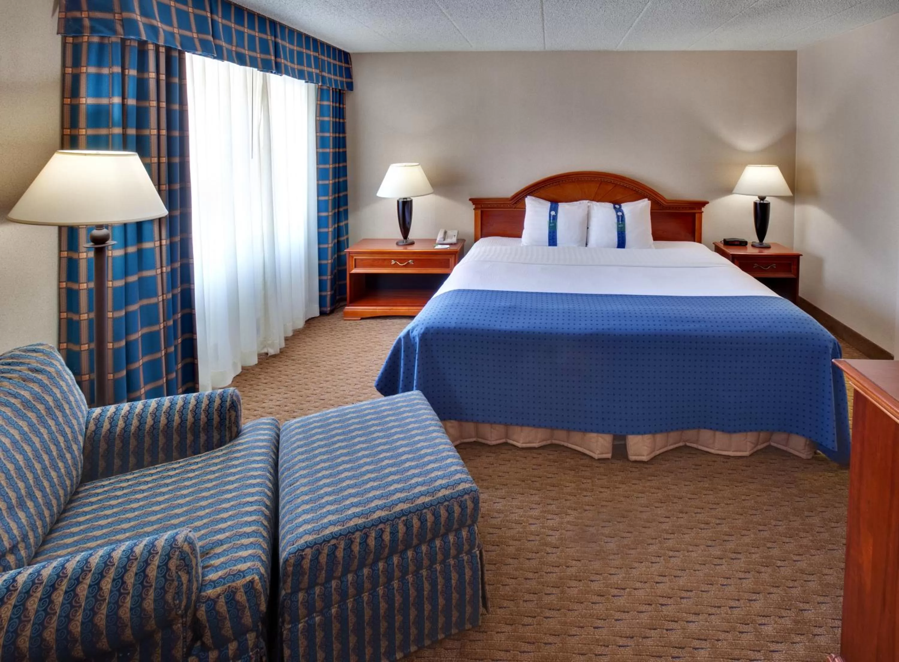 Photo of the whole room, Bed in Ramada by Wyndham Midtown Grand Island