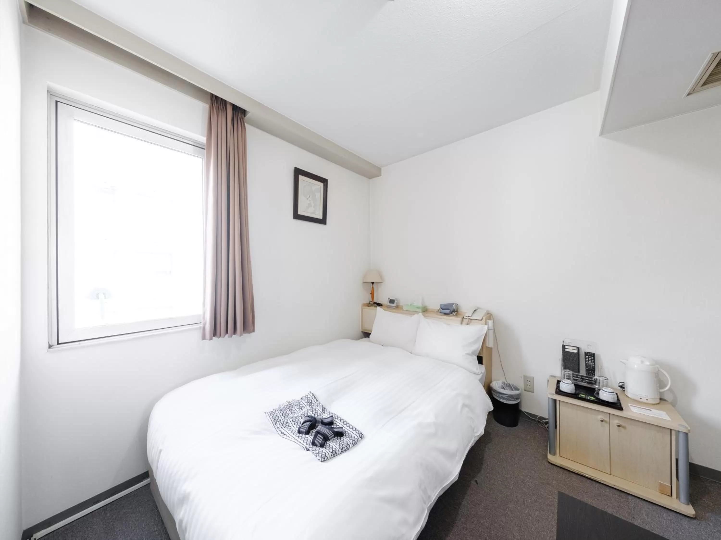 Bed in Tabist THE GREEN ASAHIKAWA