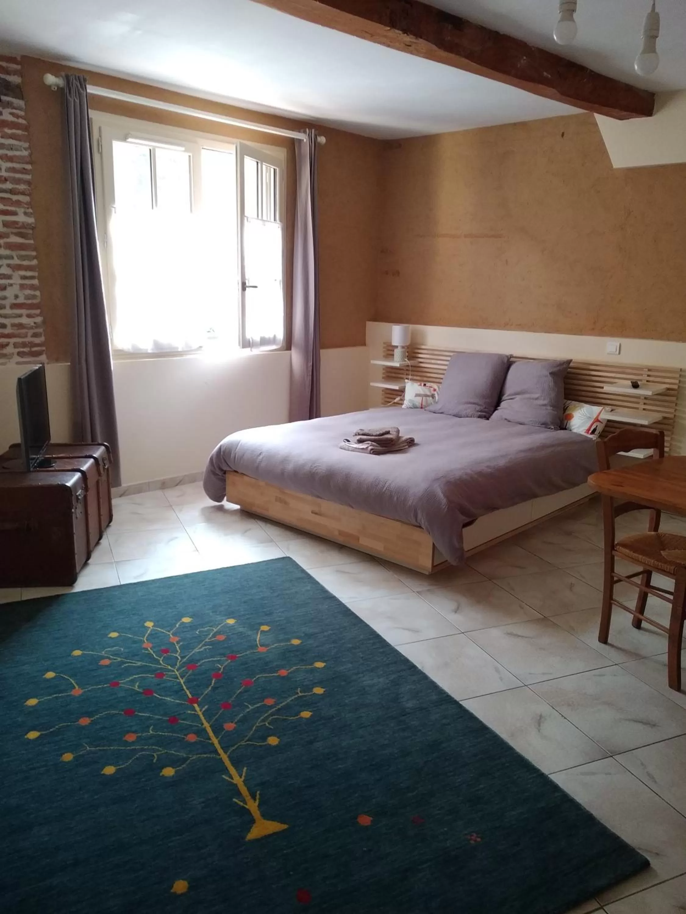Bed in Au coeur de Montastruc-la-Conseillère - Chambres d'hôtes