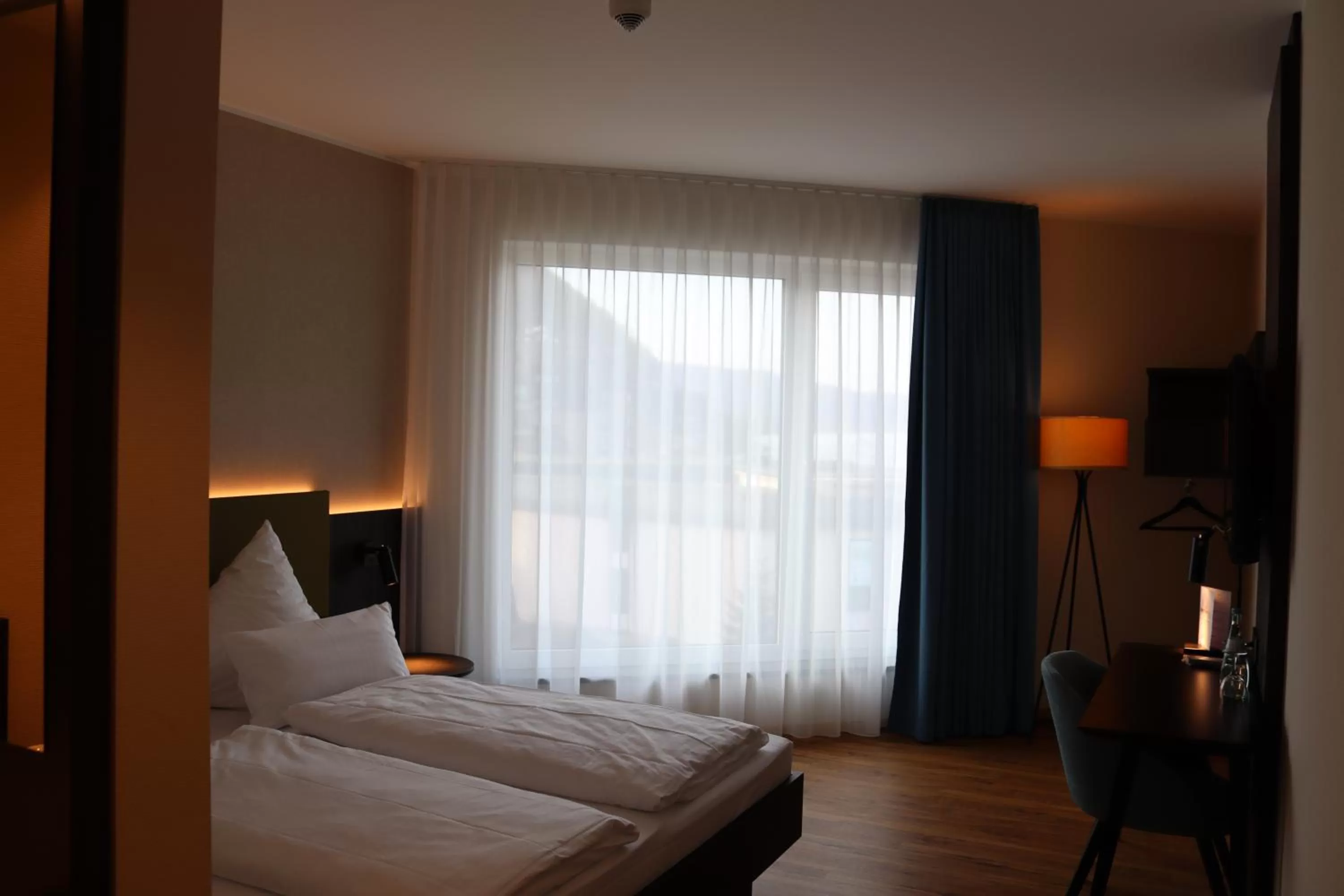 Photo of the whole room, Bed in EINSTEIN Hotel am Römerpark