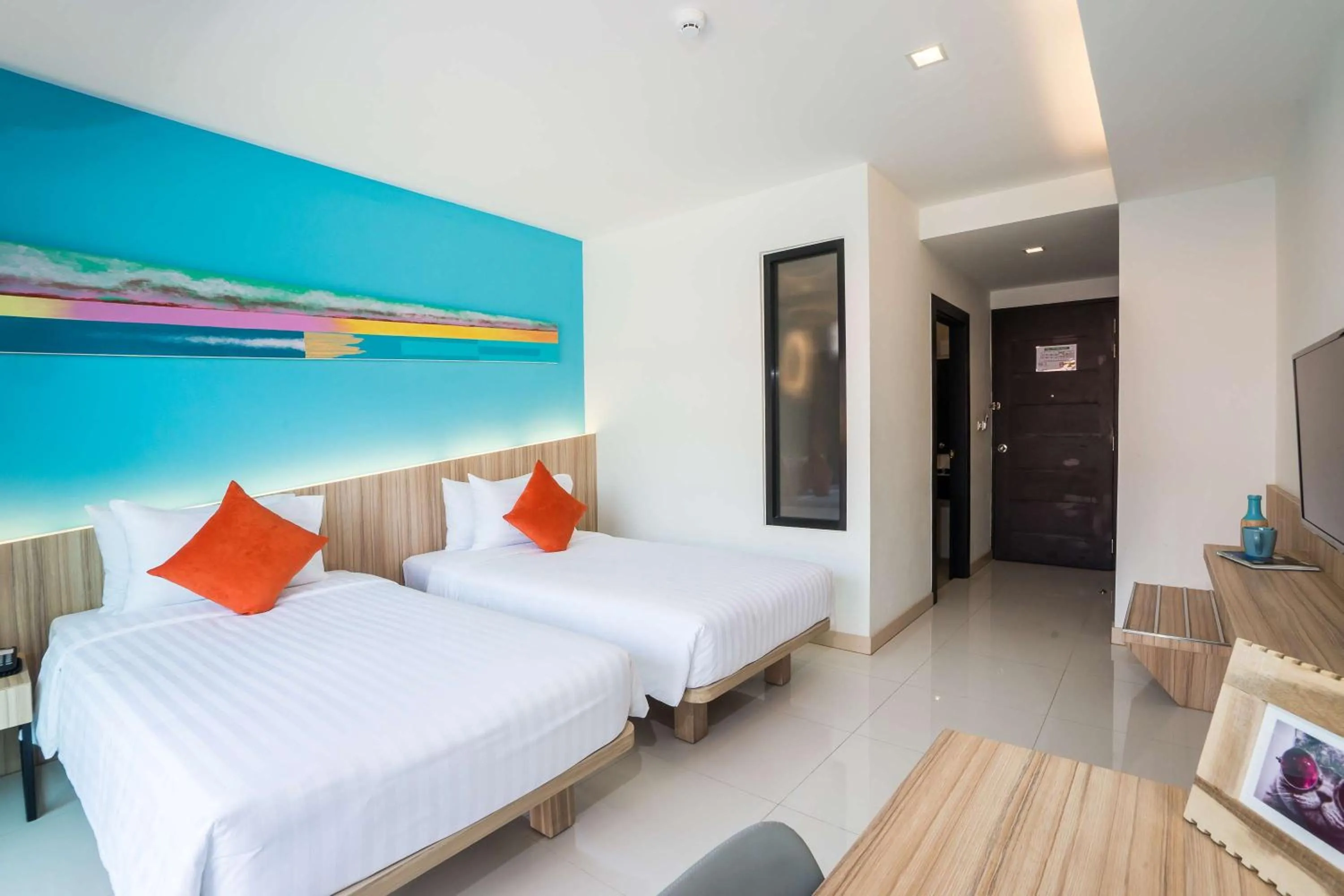 Bed in J Inspired Hotel Pattaya