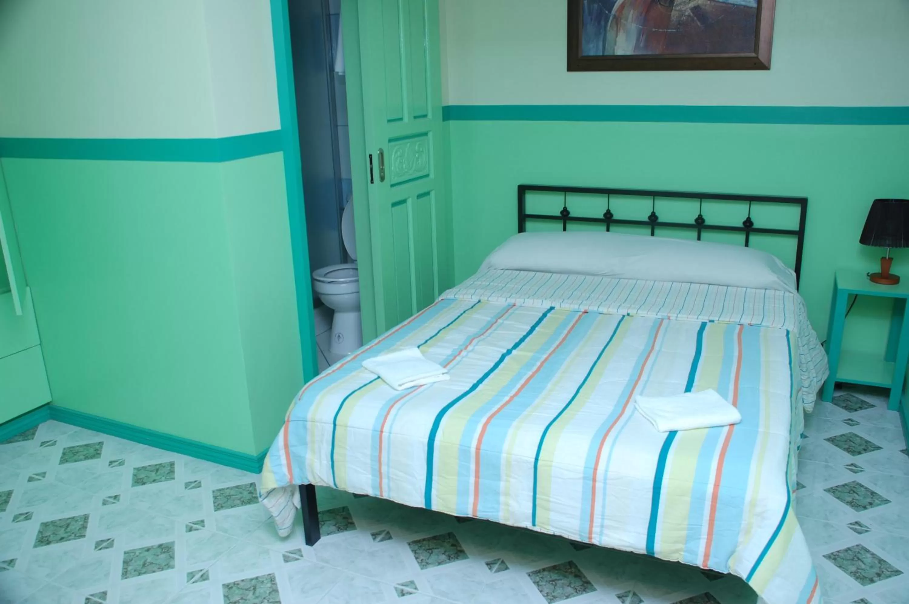 Bed in Kokomos Hotel and Restaurant