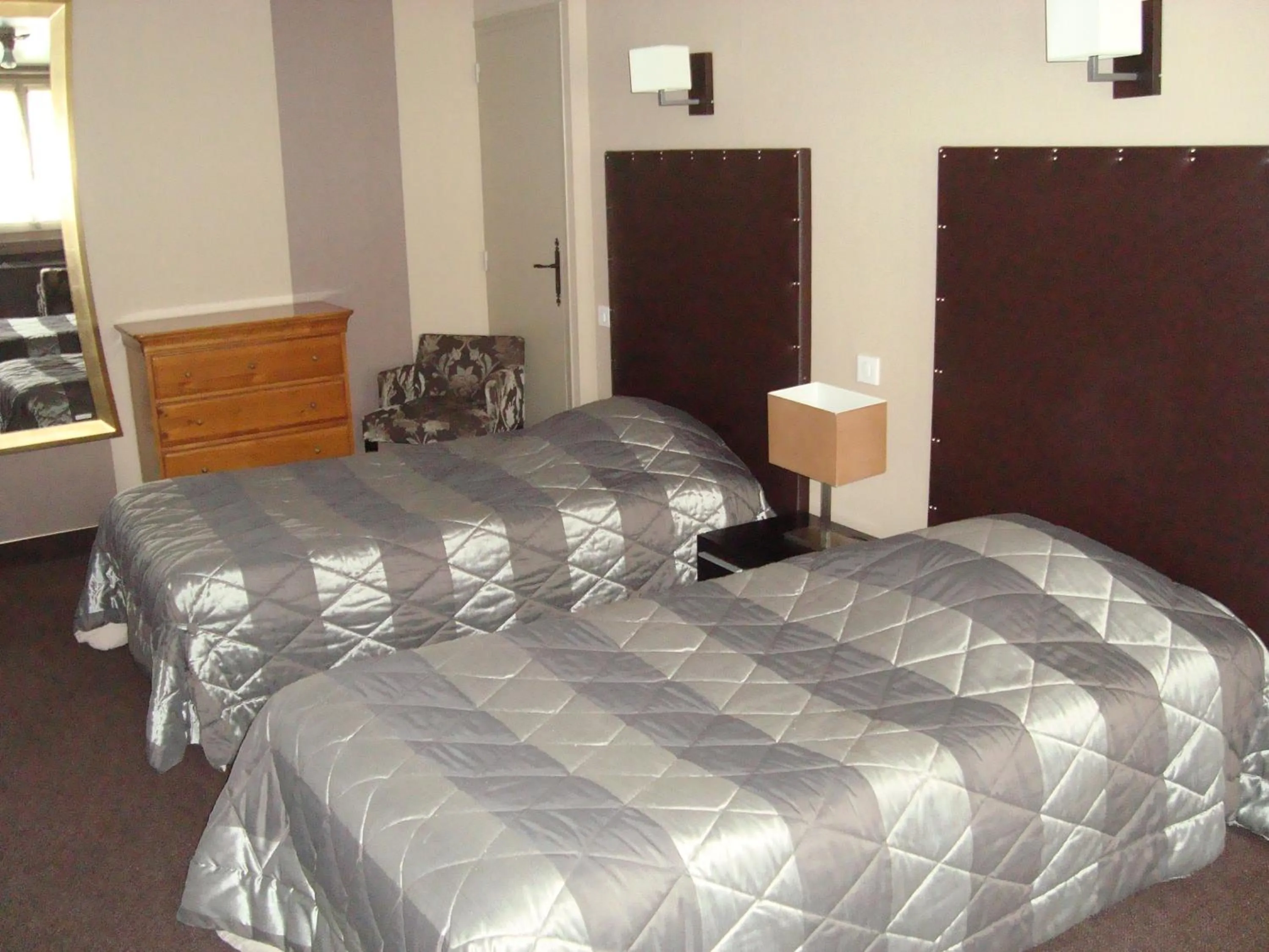 Photo of the whole room, Bed in Hôtel de La Croix d'Or