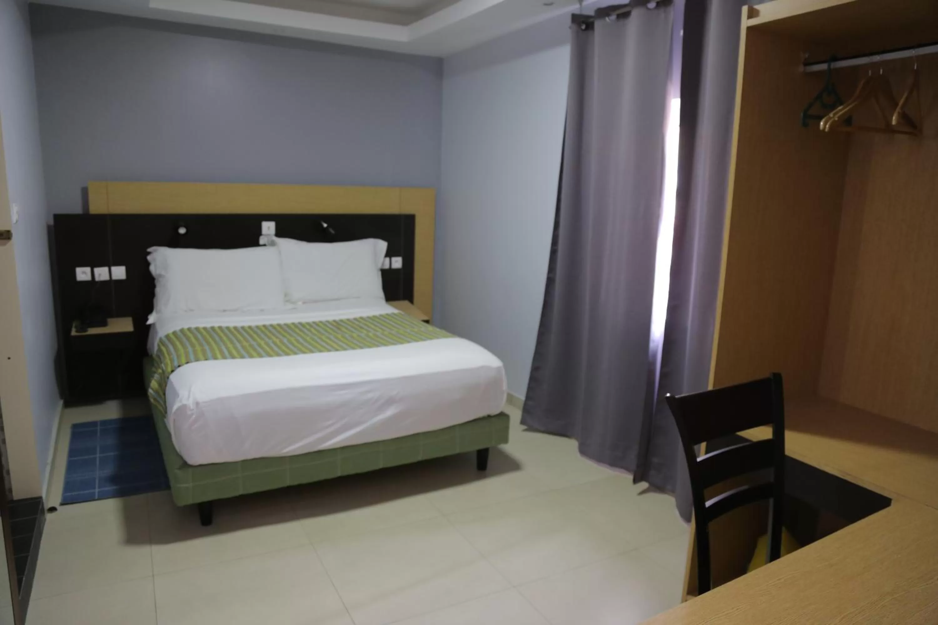 Bedroom in Fini Hotel Bobende