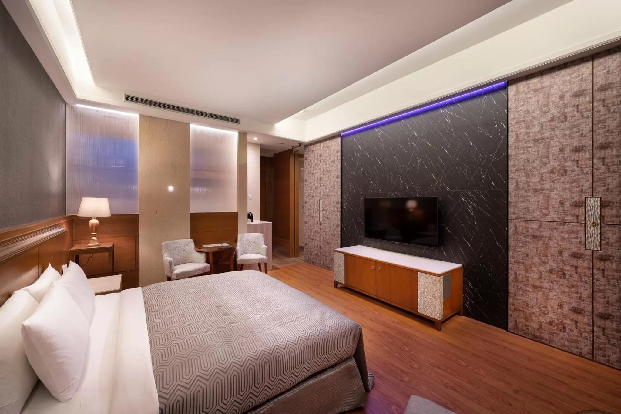 Bed in Purple Garden Motel