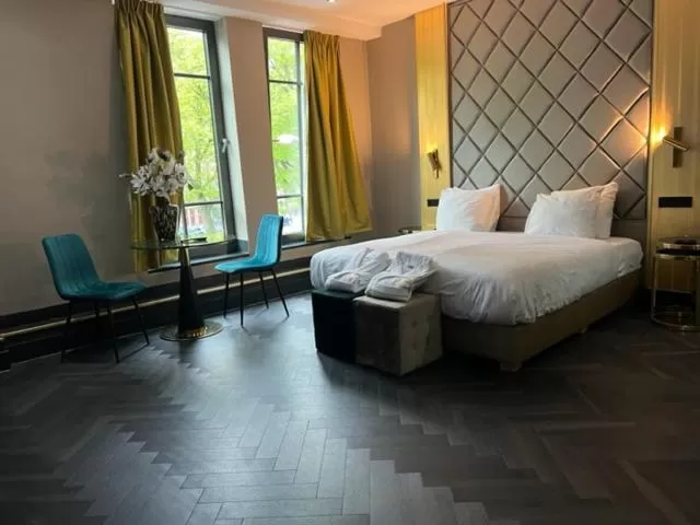 Photo of the whole room, Bed in Triple G Hotels