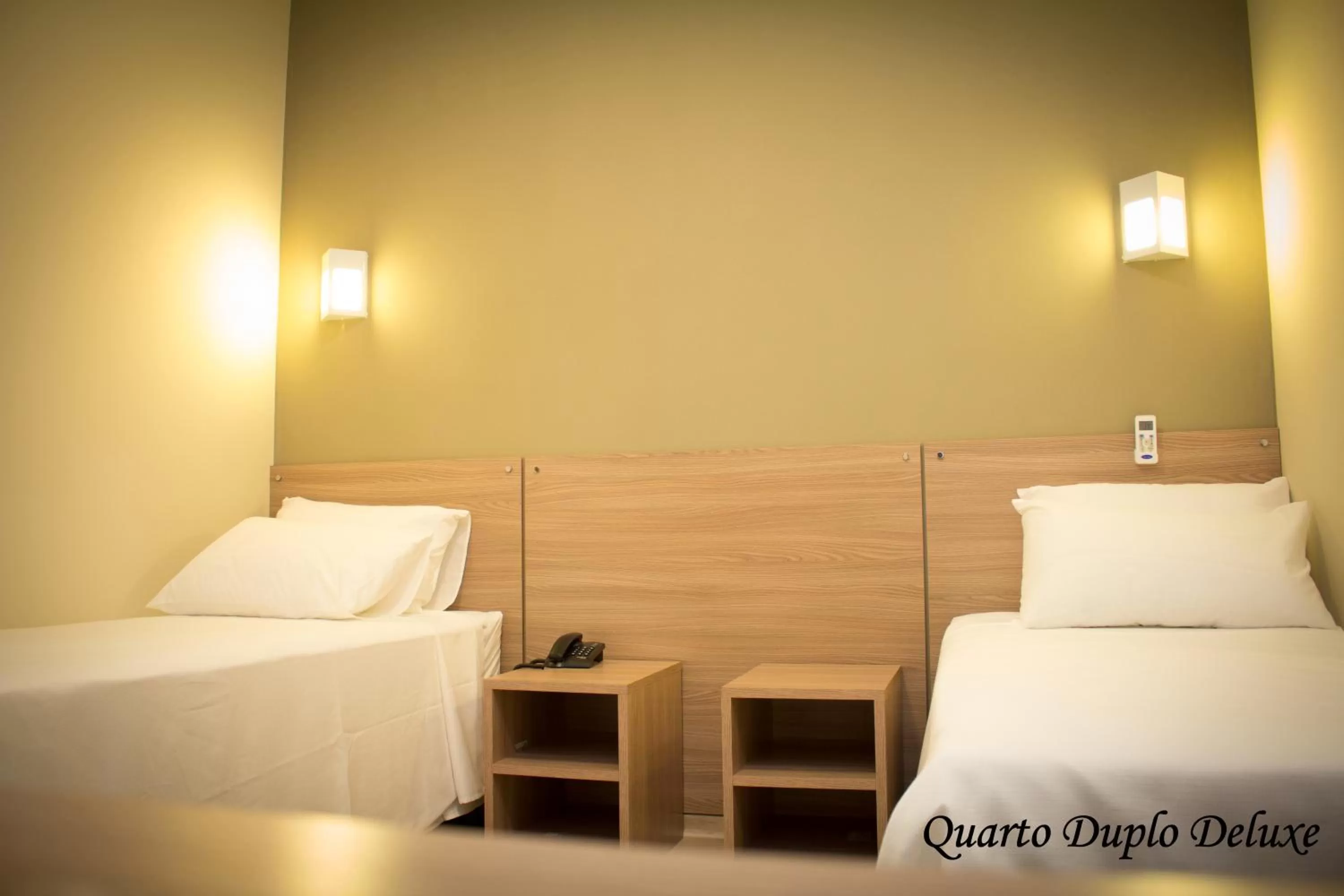 Bed in Minas Platinum Hotel & Convention