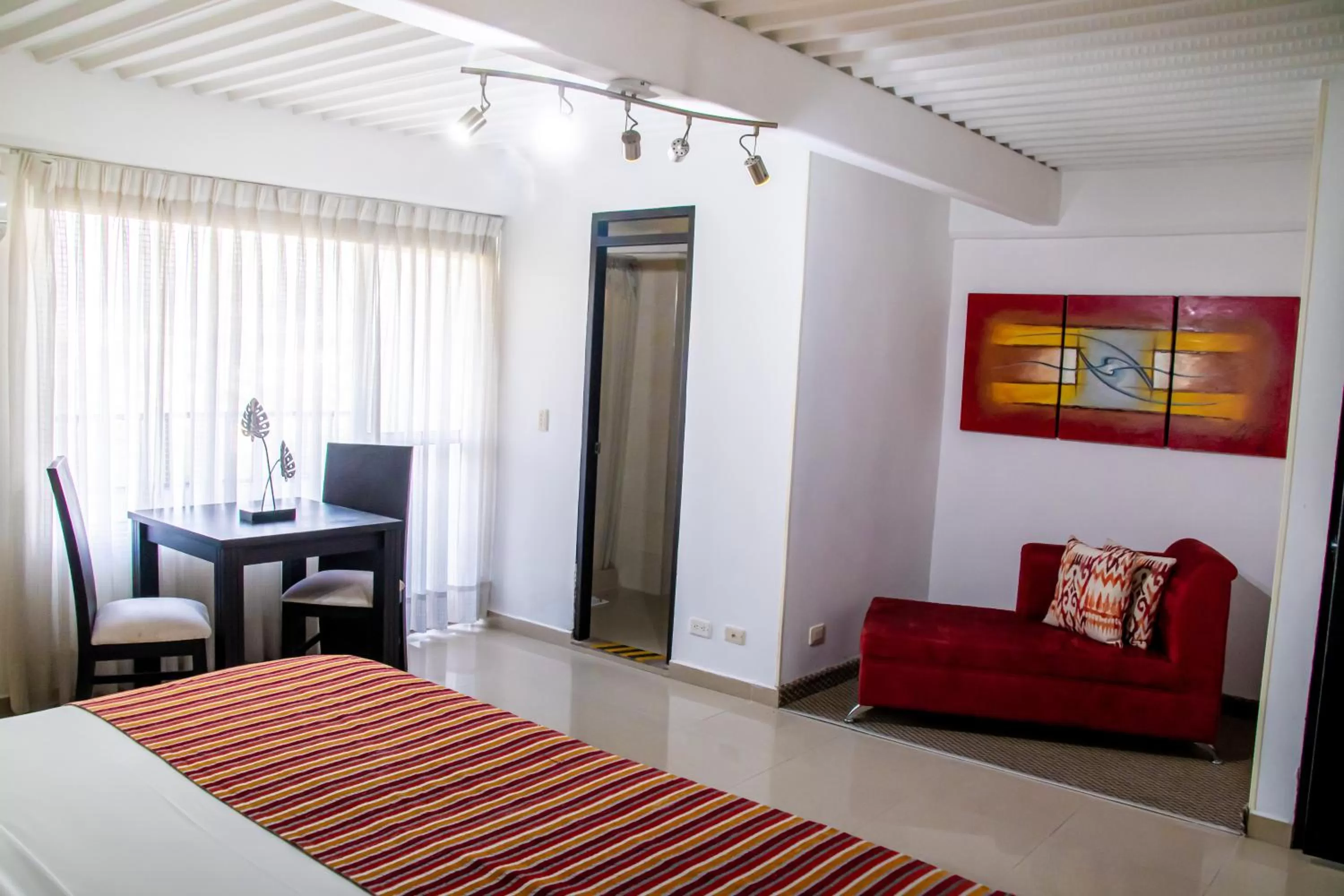 Living room, Bed in Hotel Tangara