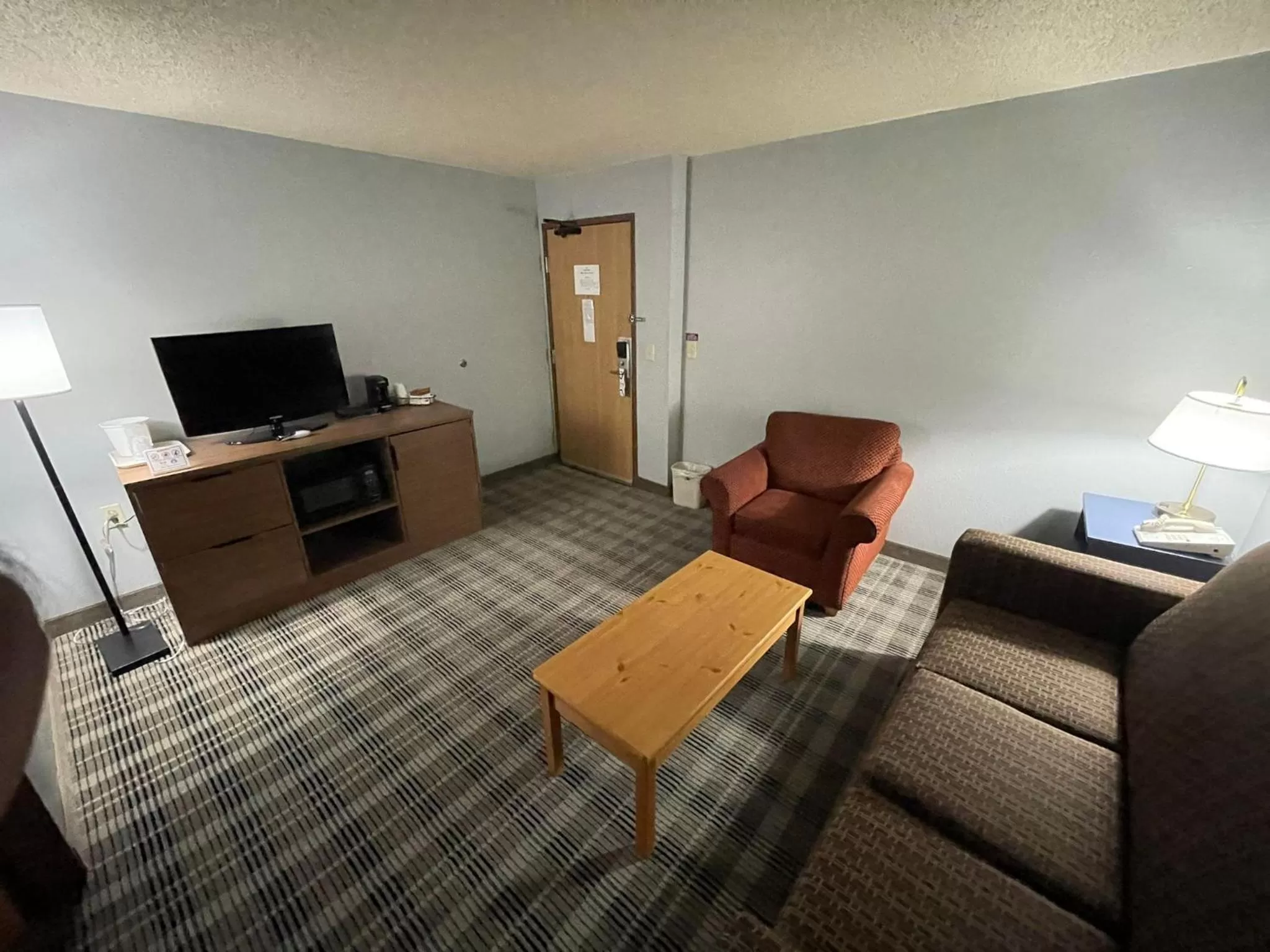 Seating area in AmericInn by Wyndham Sayre