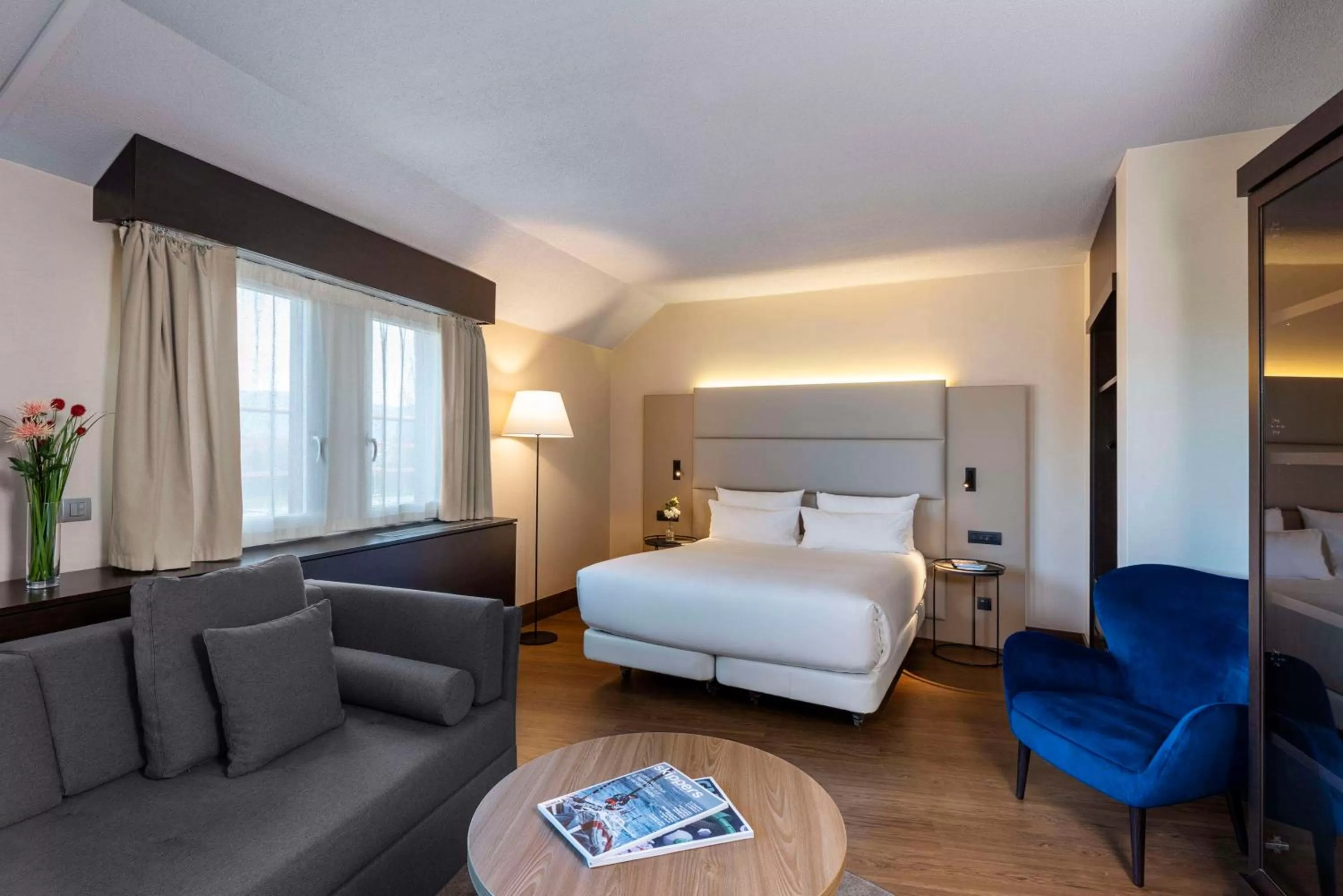 Junior Suite with Extra Bed (2 Adults + 1 Child) in NH Geneva Airport Hotel