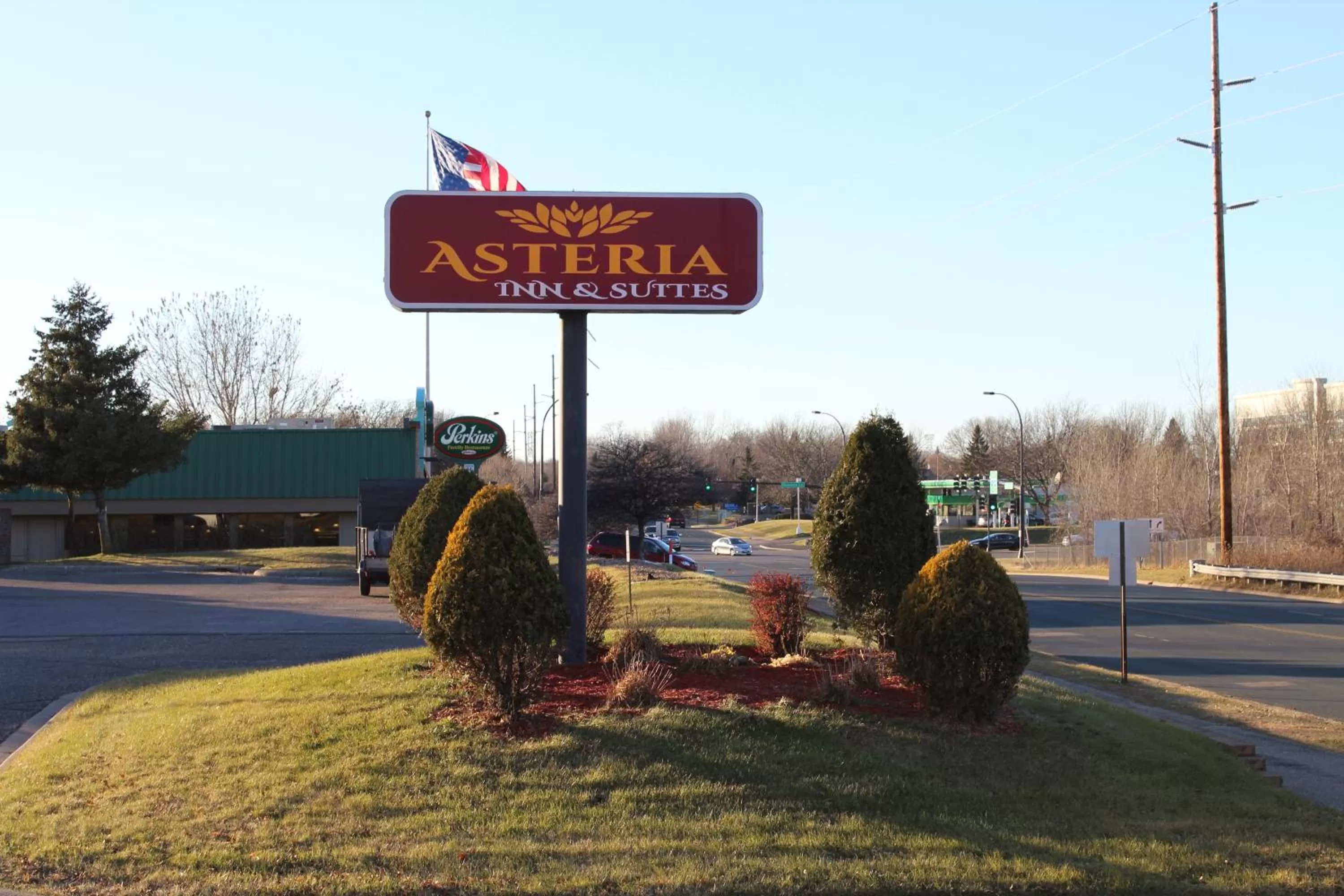 Property logo or sign in Coratel Inn and Suites Maple Grove