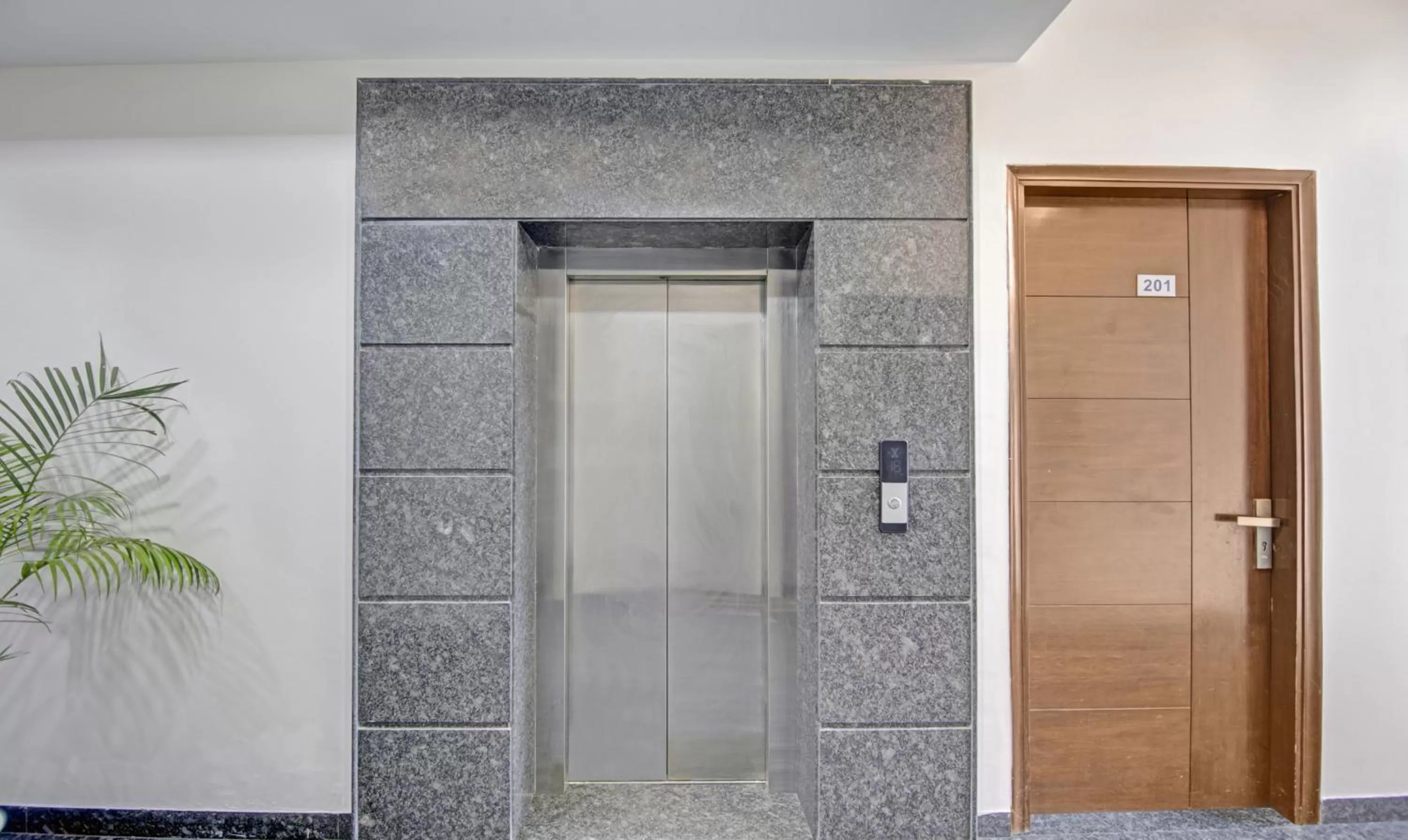 elevator, Bathroom in Treebo Trend Apple Pie