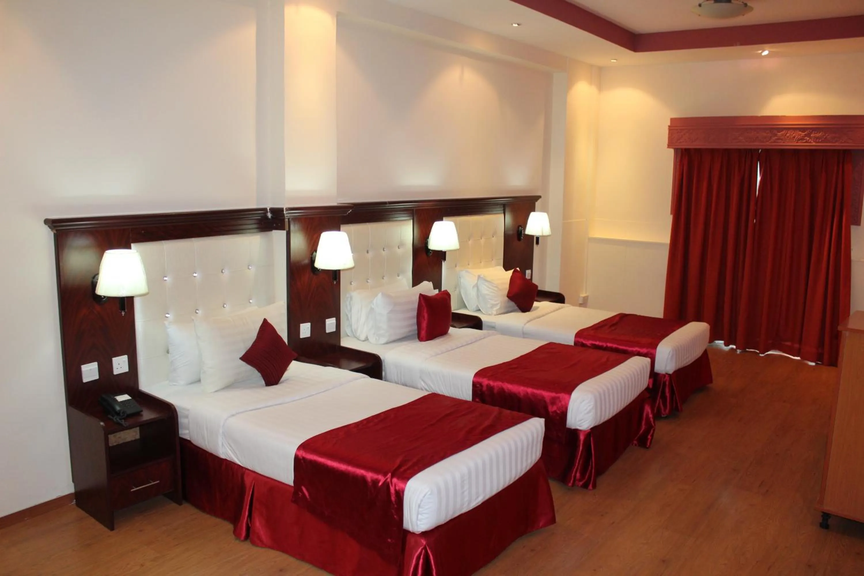 Bed in Grand Nova Hotel