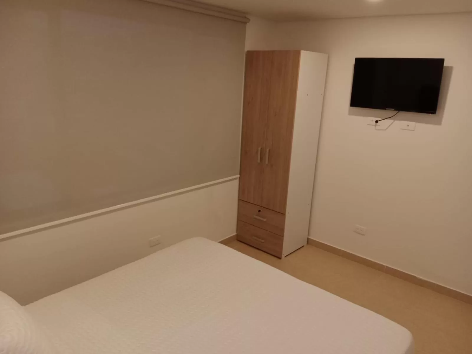 Bed, TV/Entertainment Center in Aparta Suite Plaza Premium by Tourism Yossa