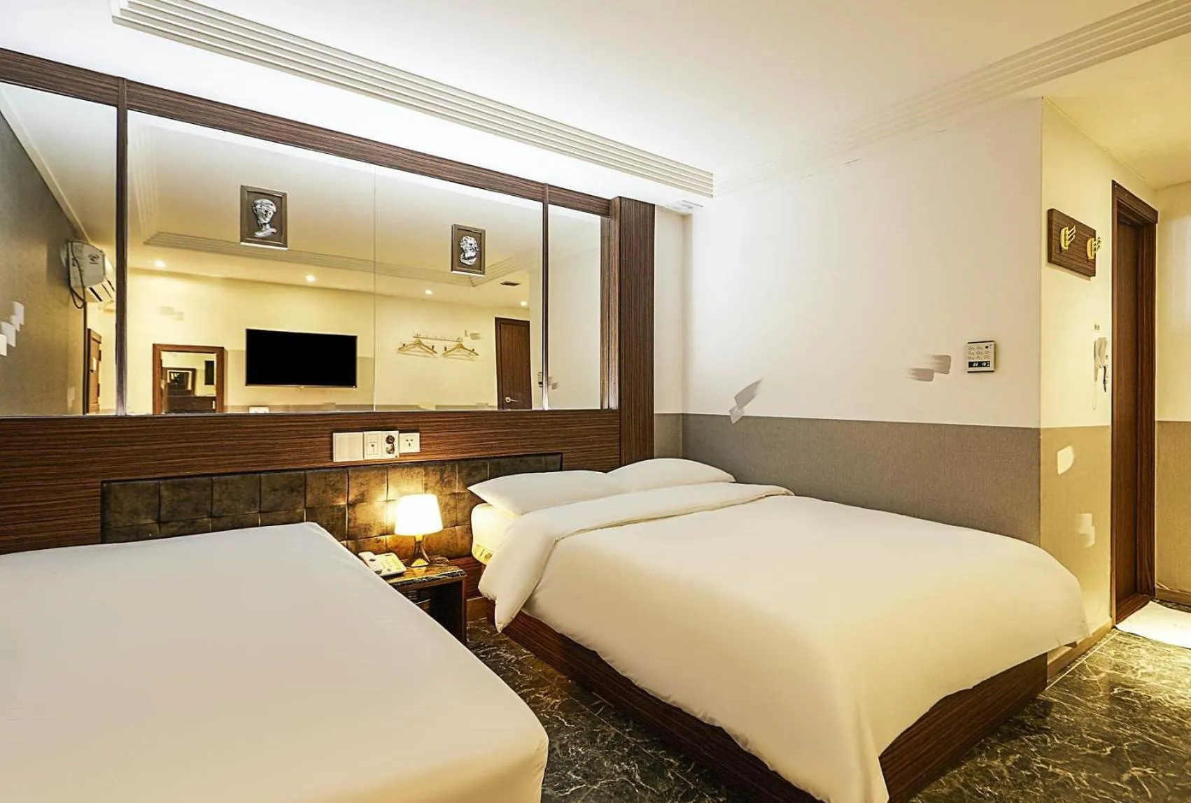 Bed in Friendly DH Naissance Hotel by Mindrum Group