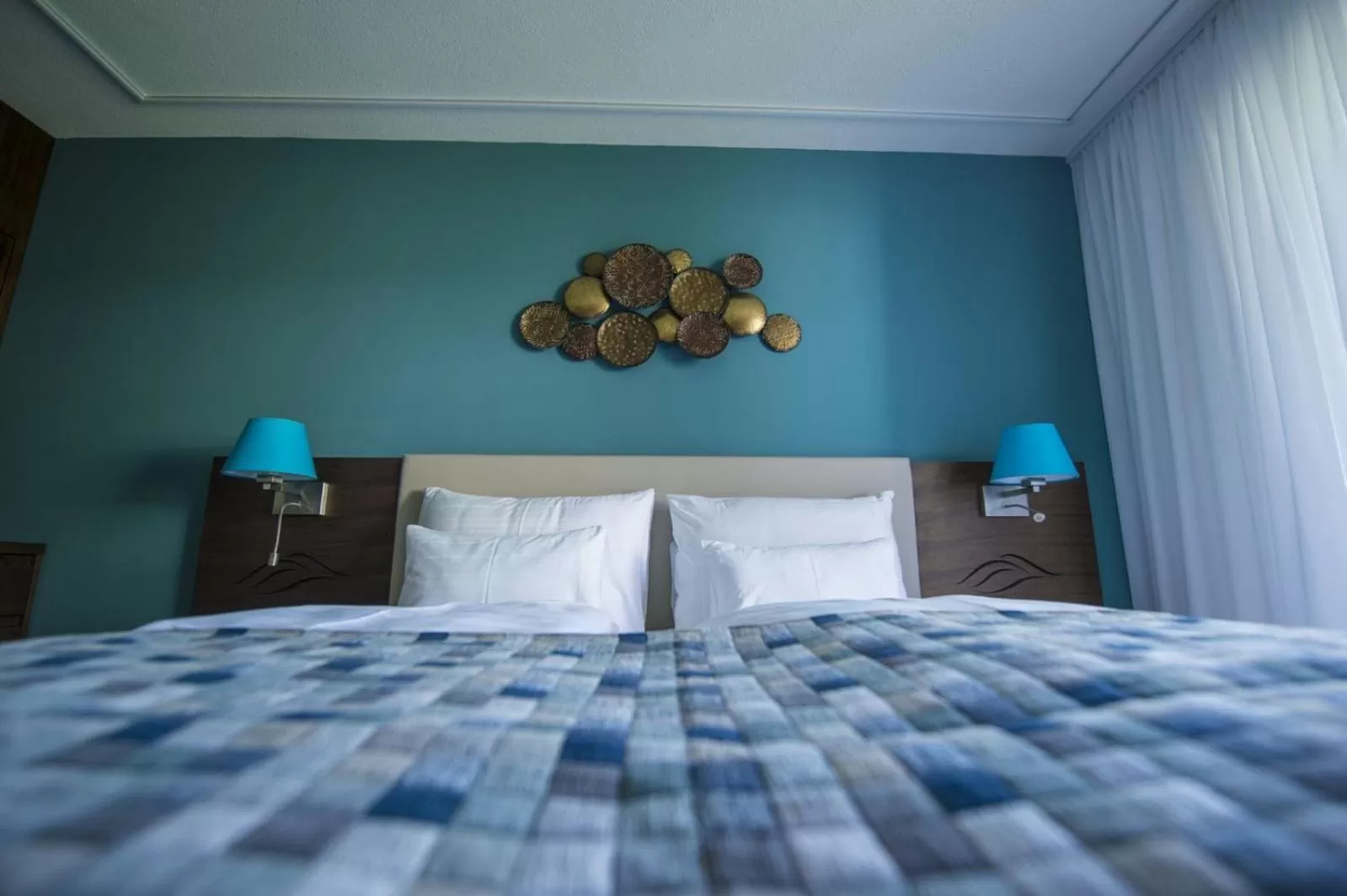 Decorative detail, Bed in Boutiquehotel Wörthersee - Serviced Apartments