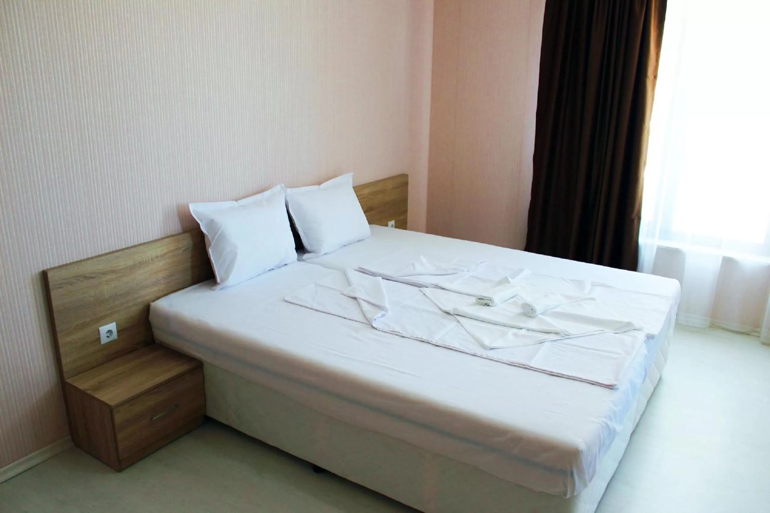 Bed in APART-HOTEL Stamopolu Lux с изглед към морето