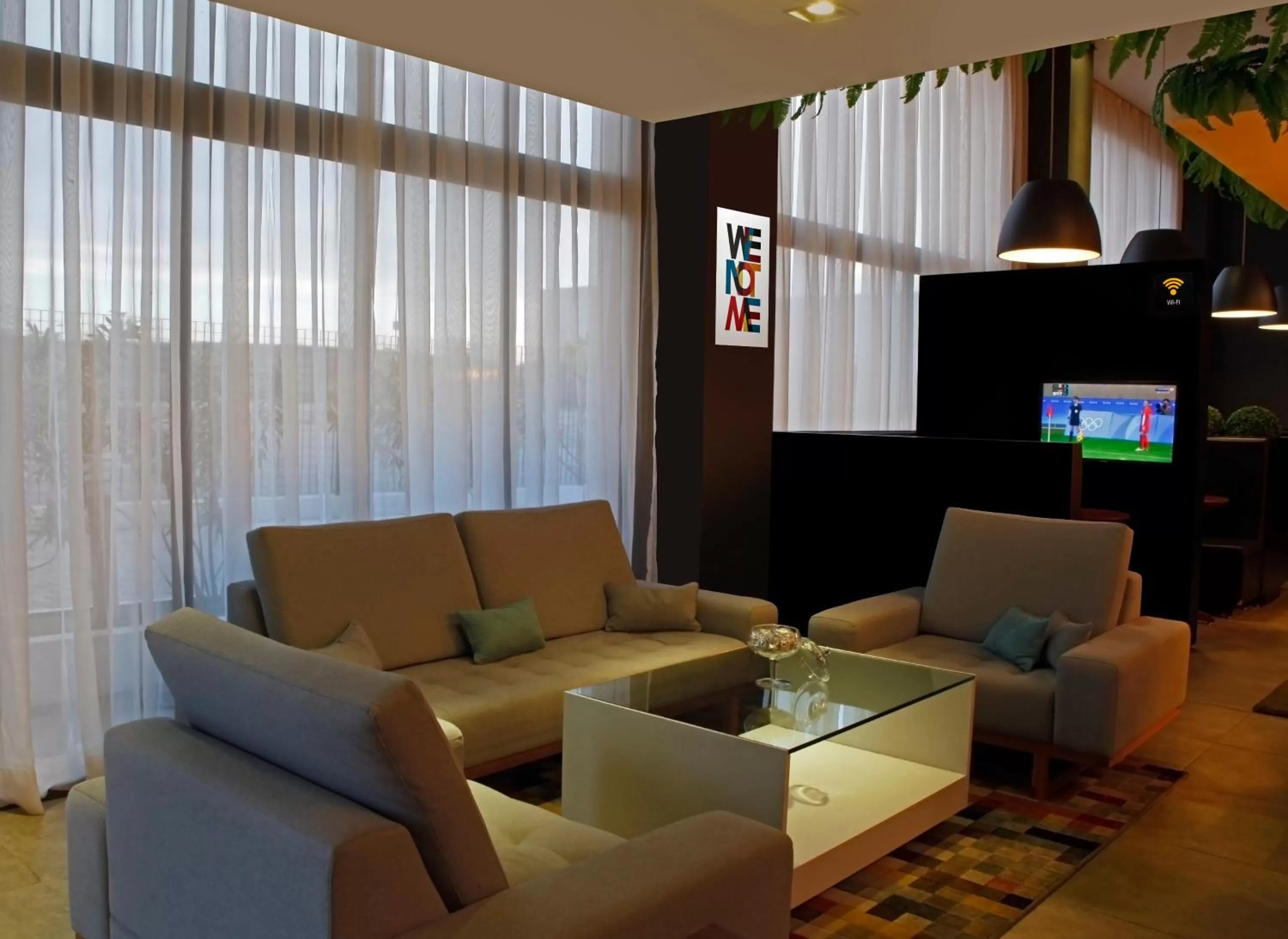 Communal lounge/ TV room in ibis Styles Maracanau