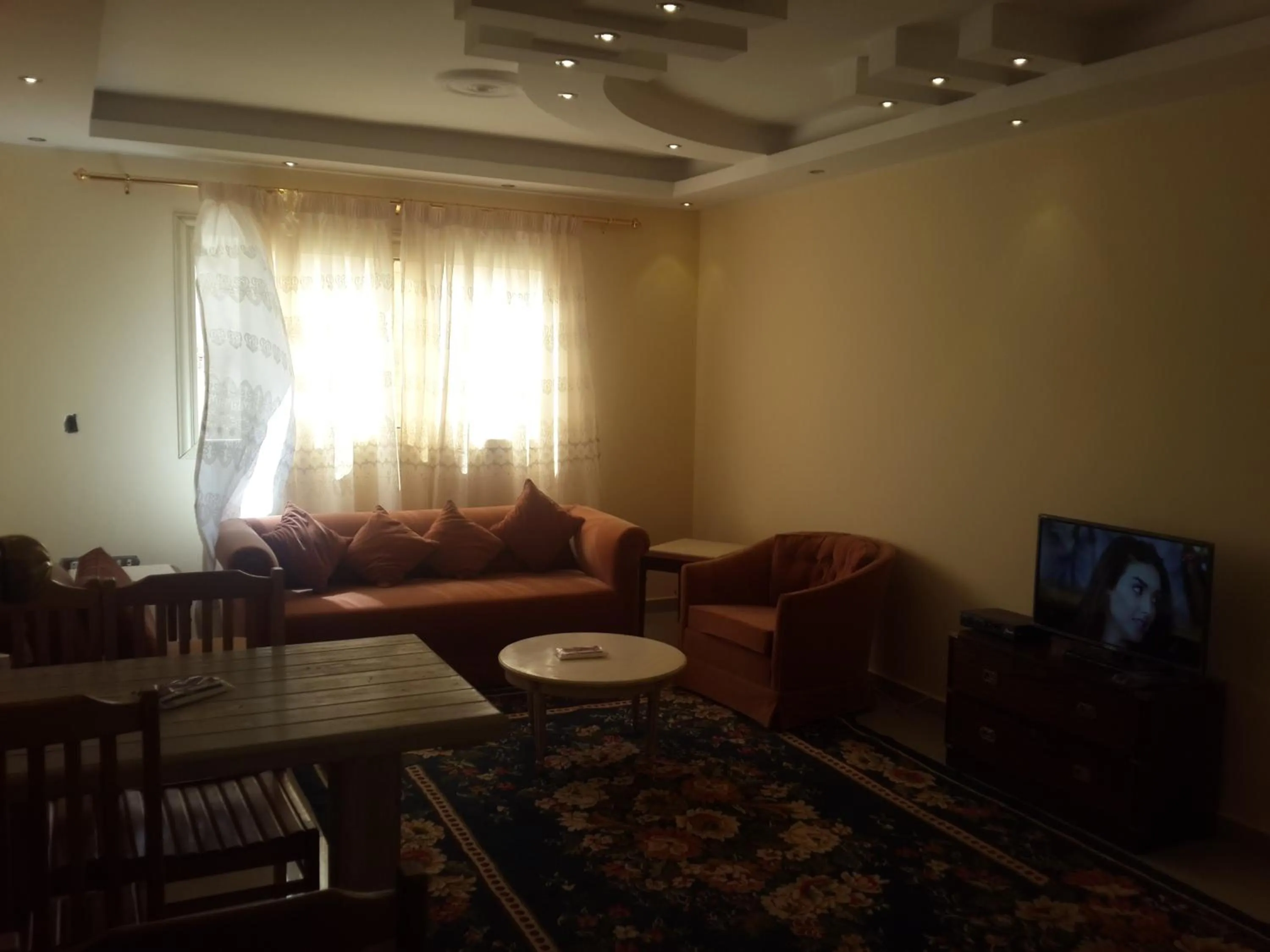 Communal lounge/ TV room in Alexander The Great Hotel