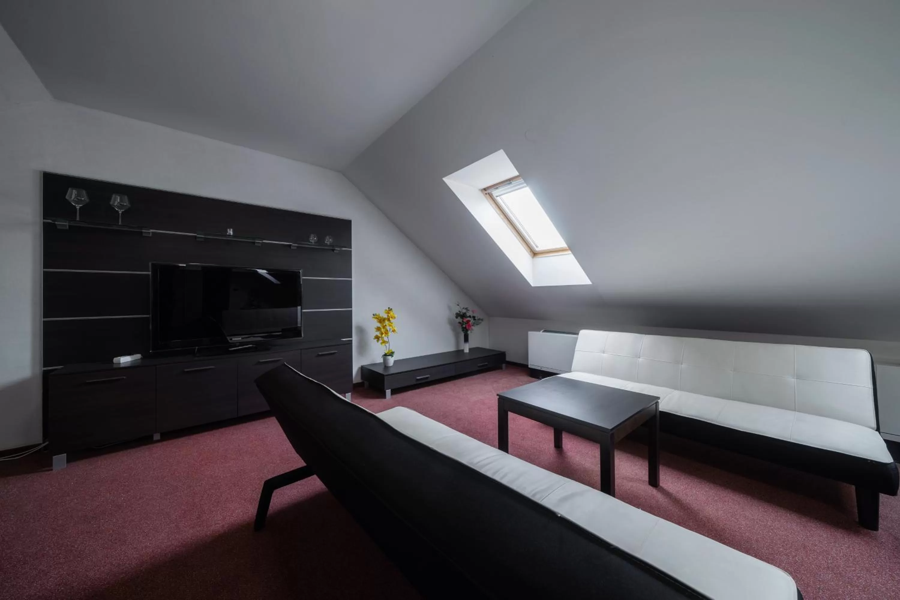 Communal lounge/ TV room in Hotel Astory Plzeň