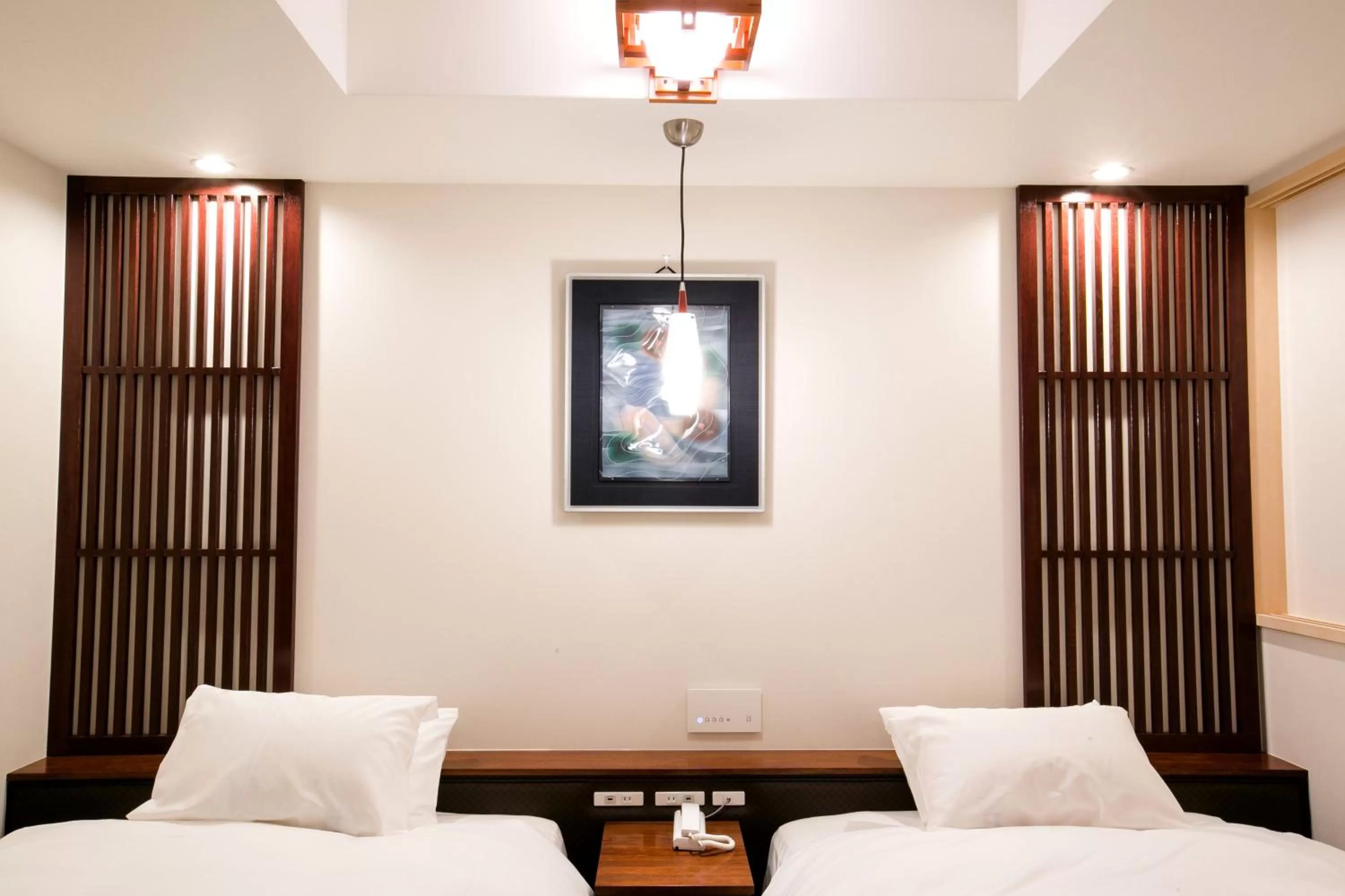 Bed in Kyoto Kamanza Hotel