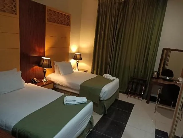 Bed in Doha Dynasty Hotel