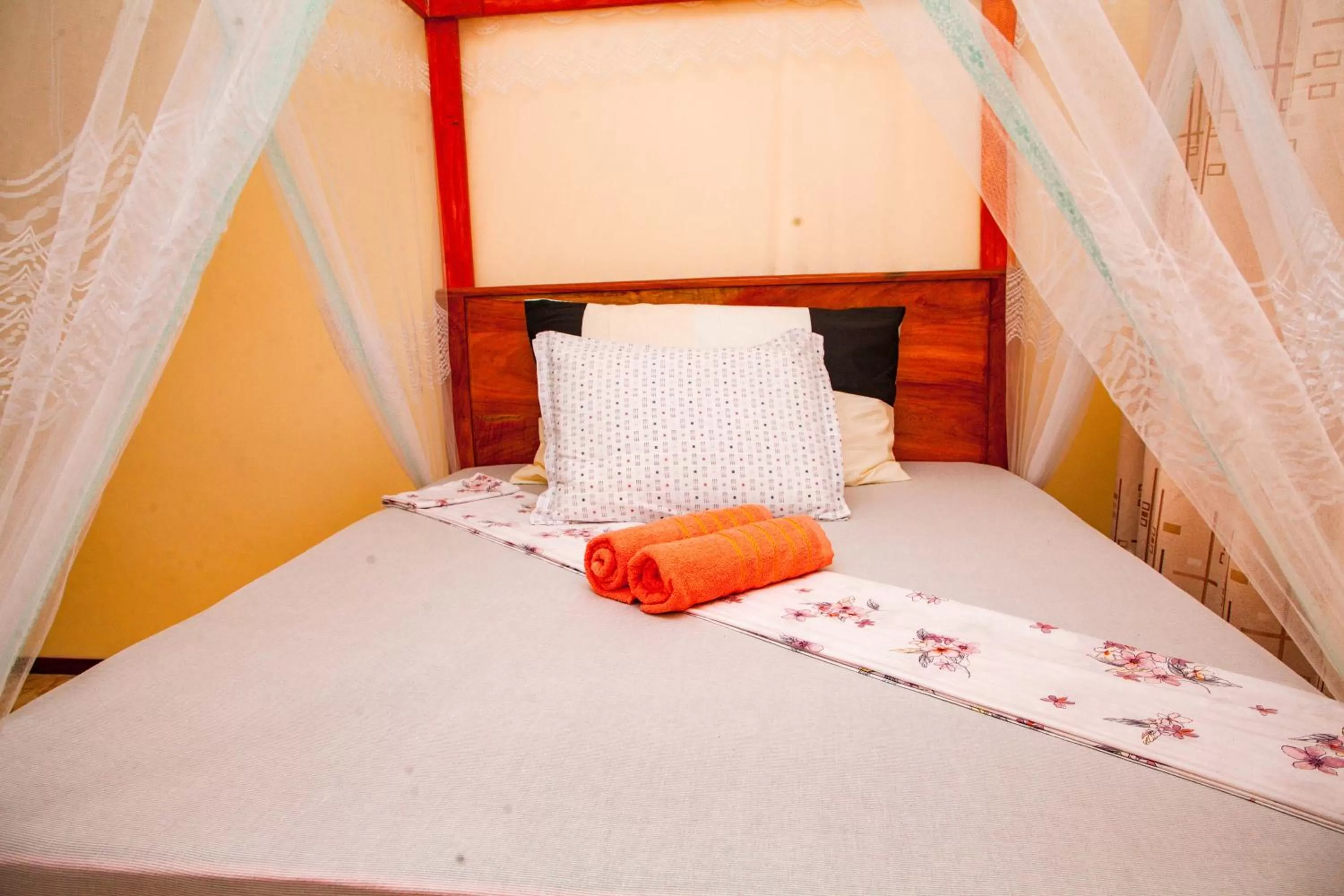 Shower, Bed in Mikoko Beach & Cottages