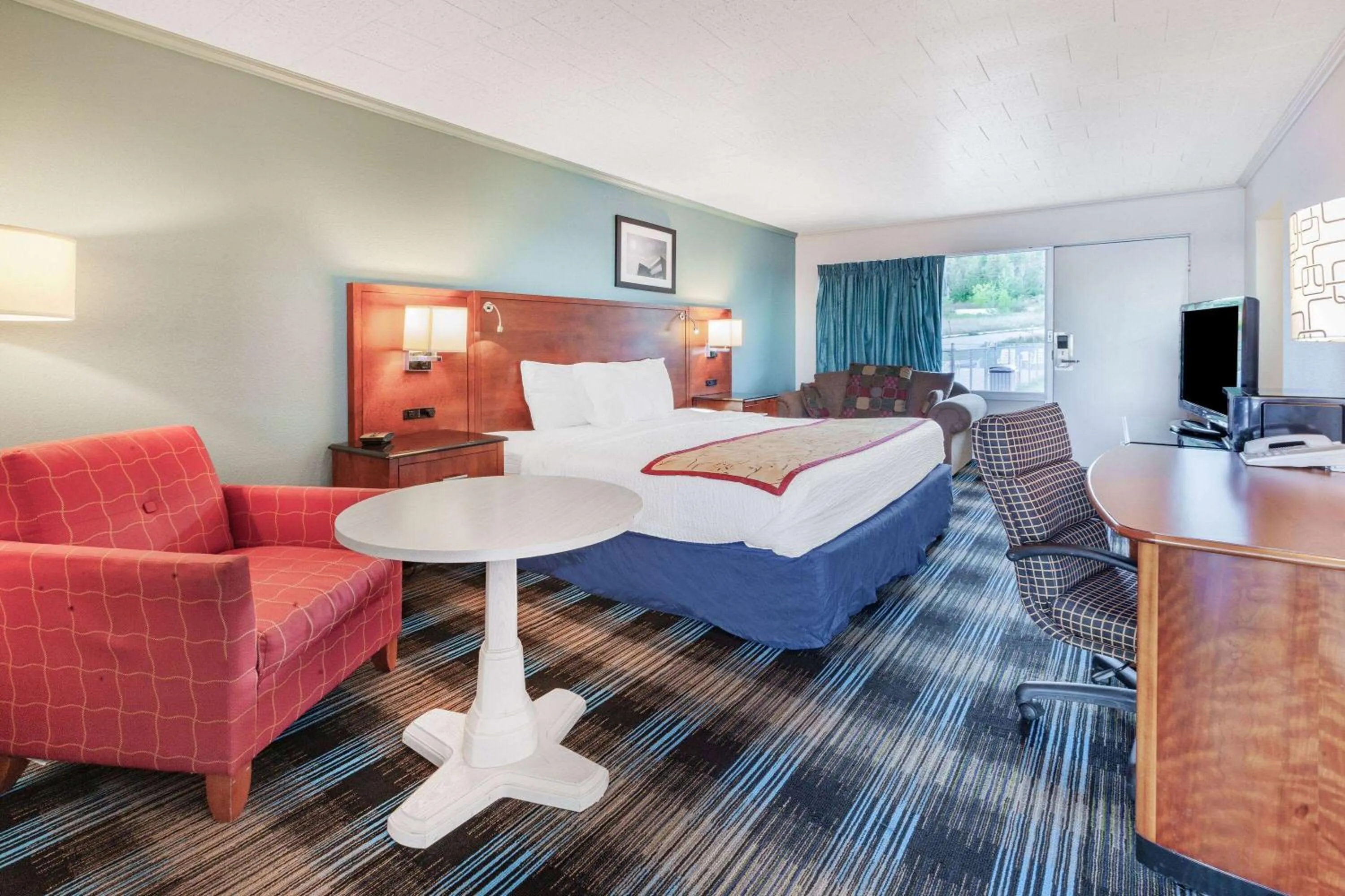 Bed in Days Inn & Suites by Wyndham St. Ignace Lakefront